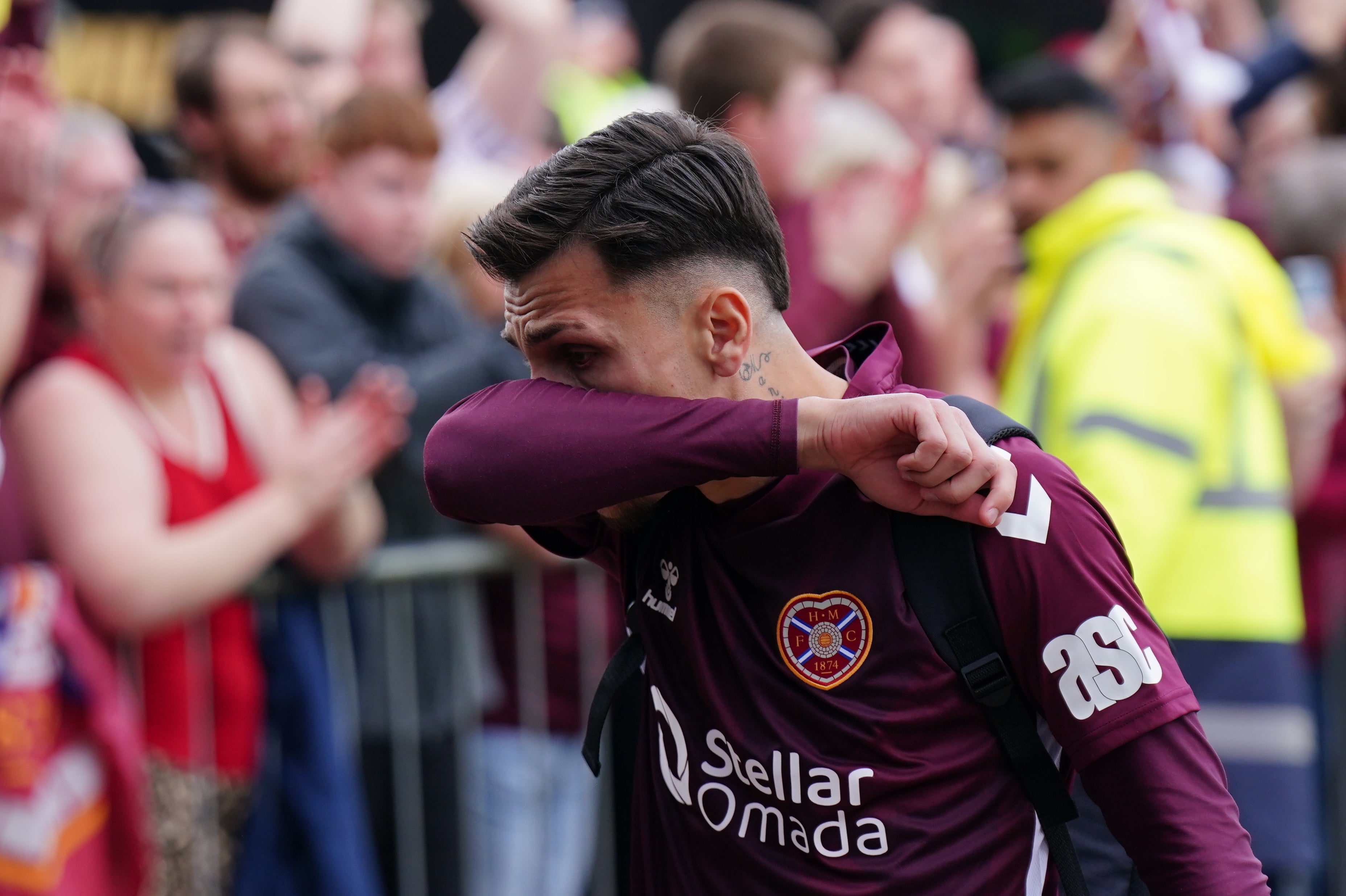 Heart of Midlothian player Alexandros Kyziridis becomes emotional as he walks past fans
