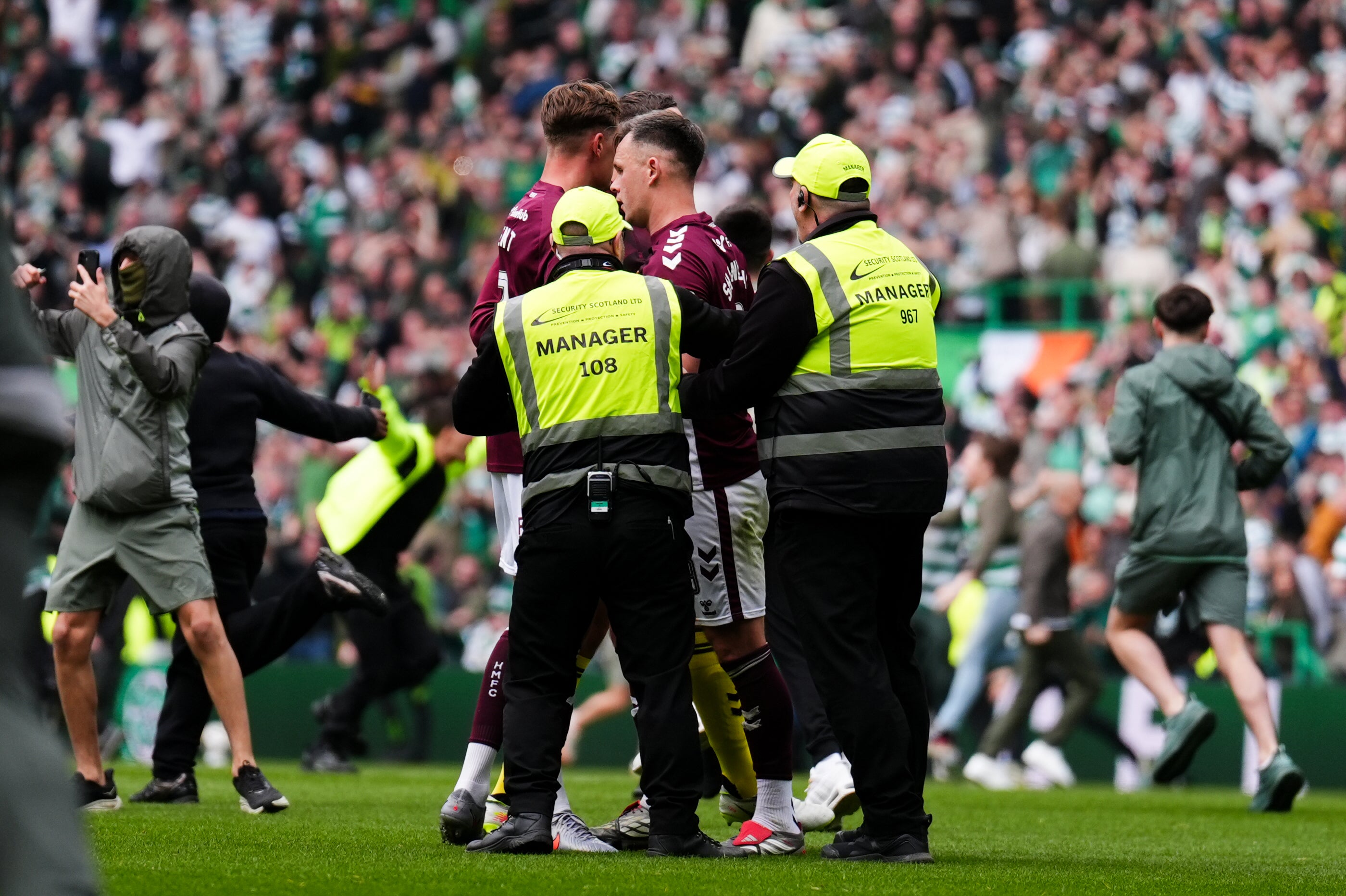 Police are liaising with Hearts to investigate whether any of their players were assaulted during a pitch invasion in Celtic’s title-winning victory at Parkhead