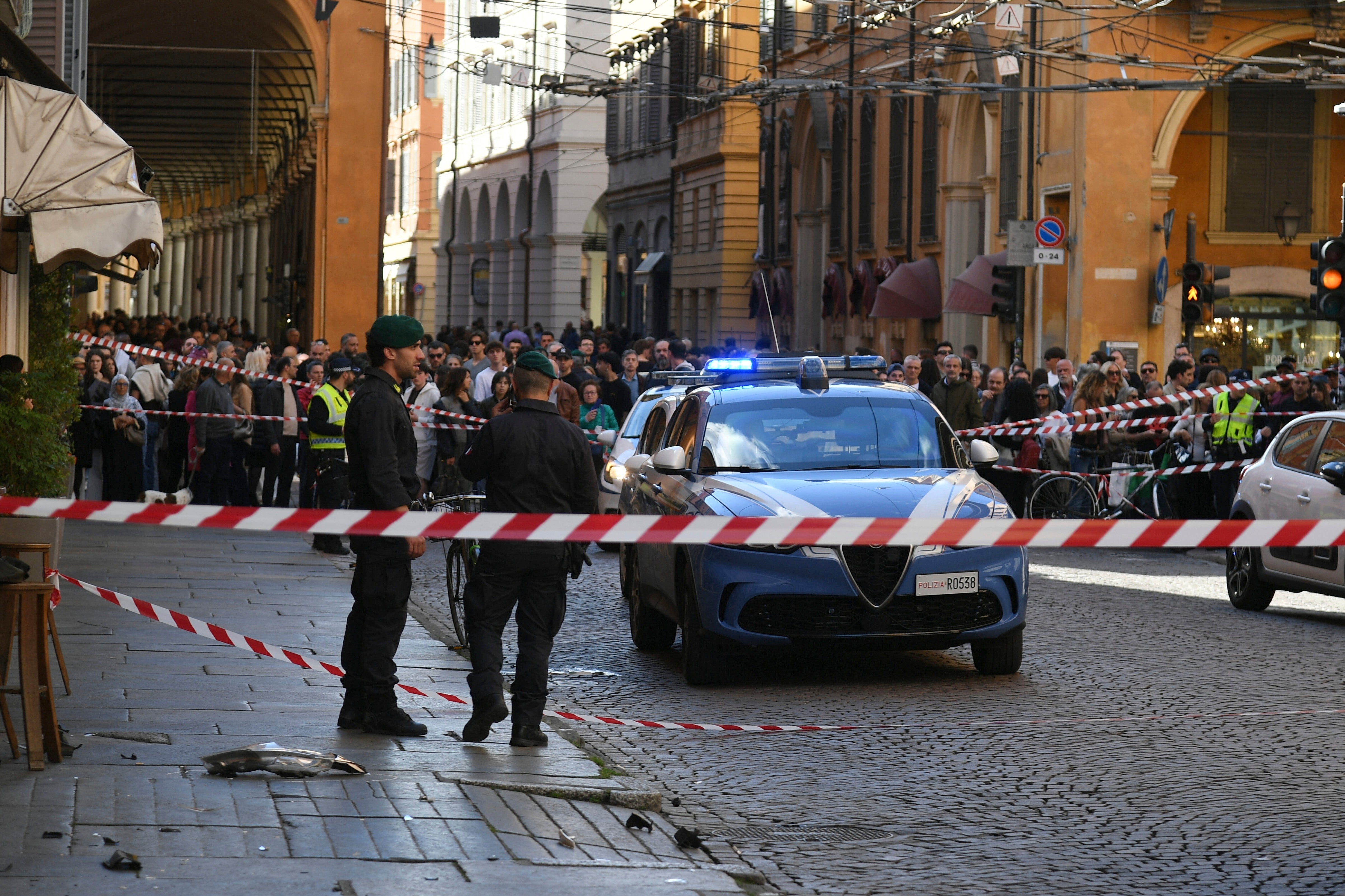 Financial Police patrol the scene after the crash