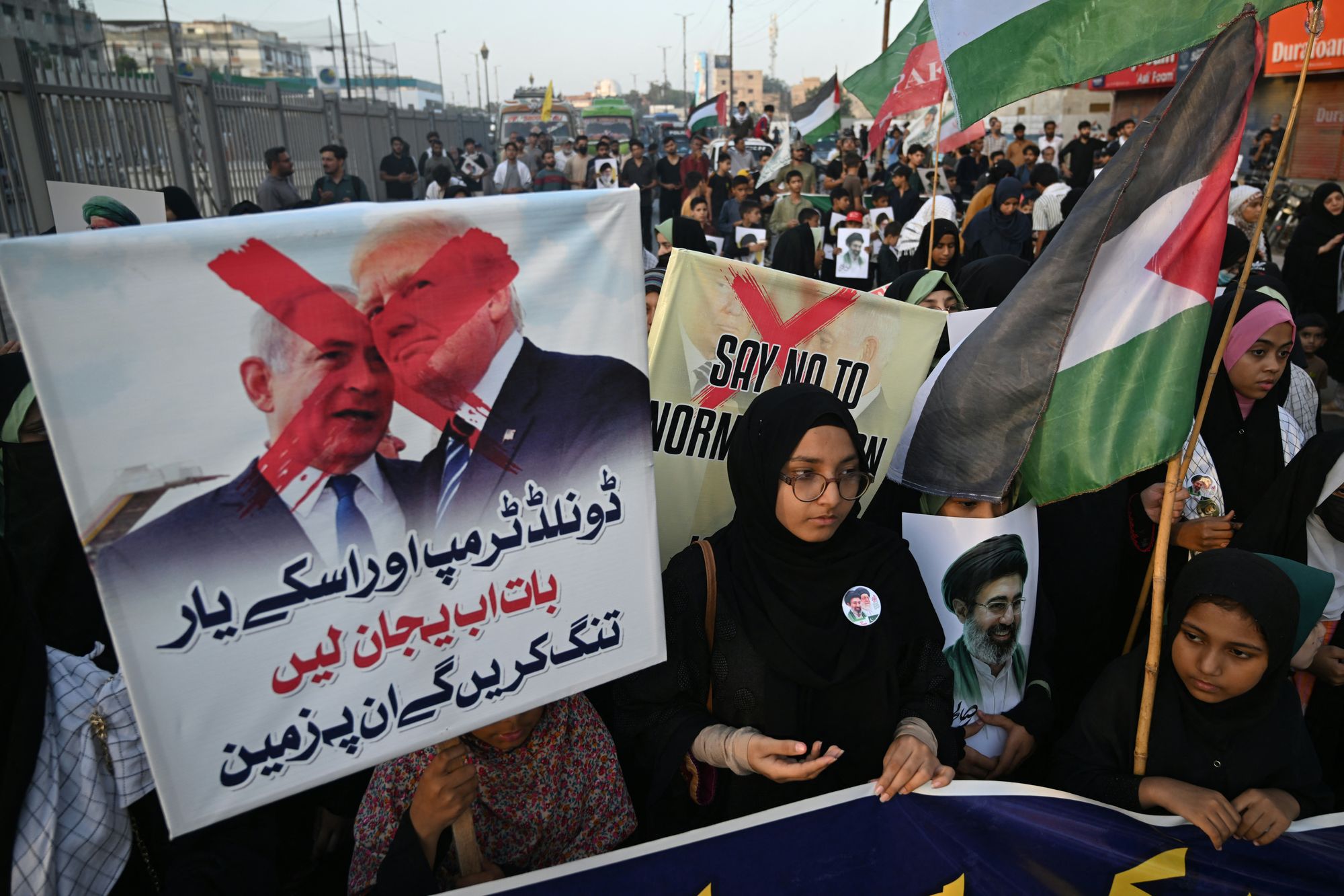 Protestors hold placards during an anti US-Israel protest in Karachi on May 16 (AFP via Getty Images)