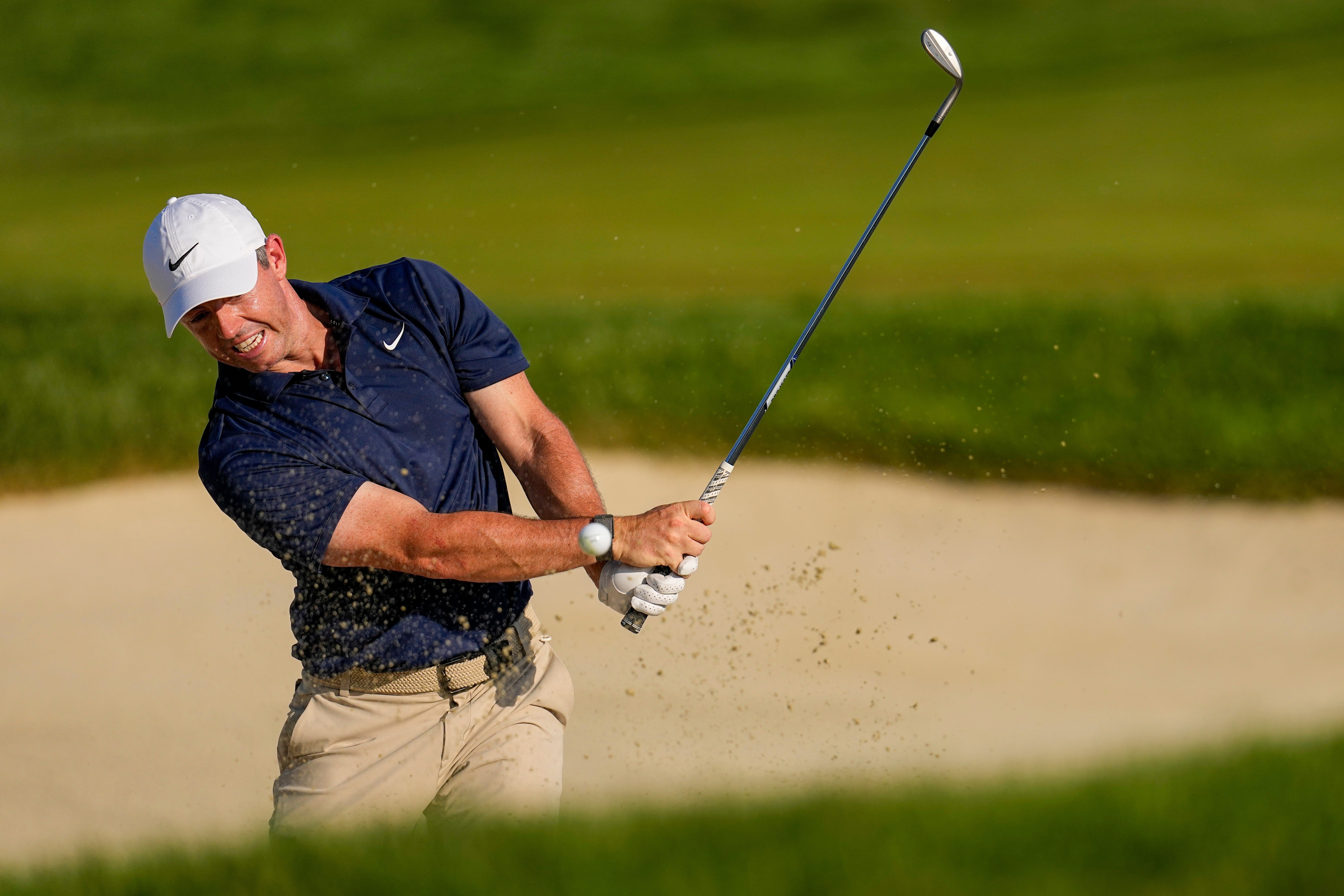 Rory McIlroy fought to challenge but couldn't make use of the long par fives as Rai began to make his move