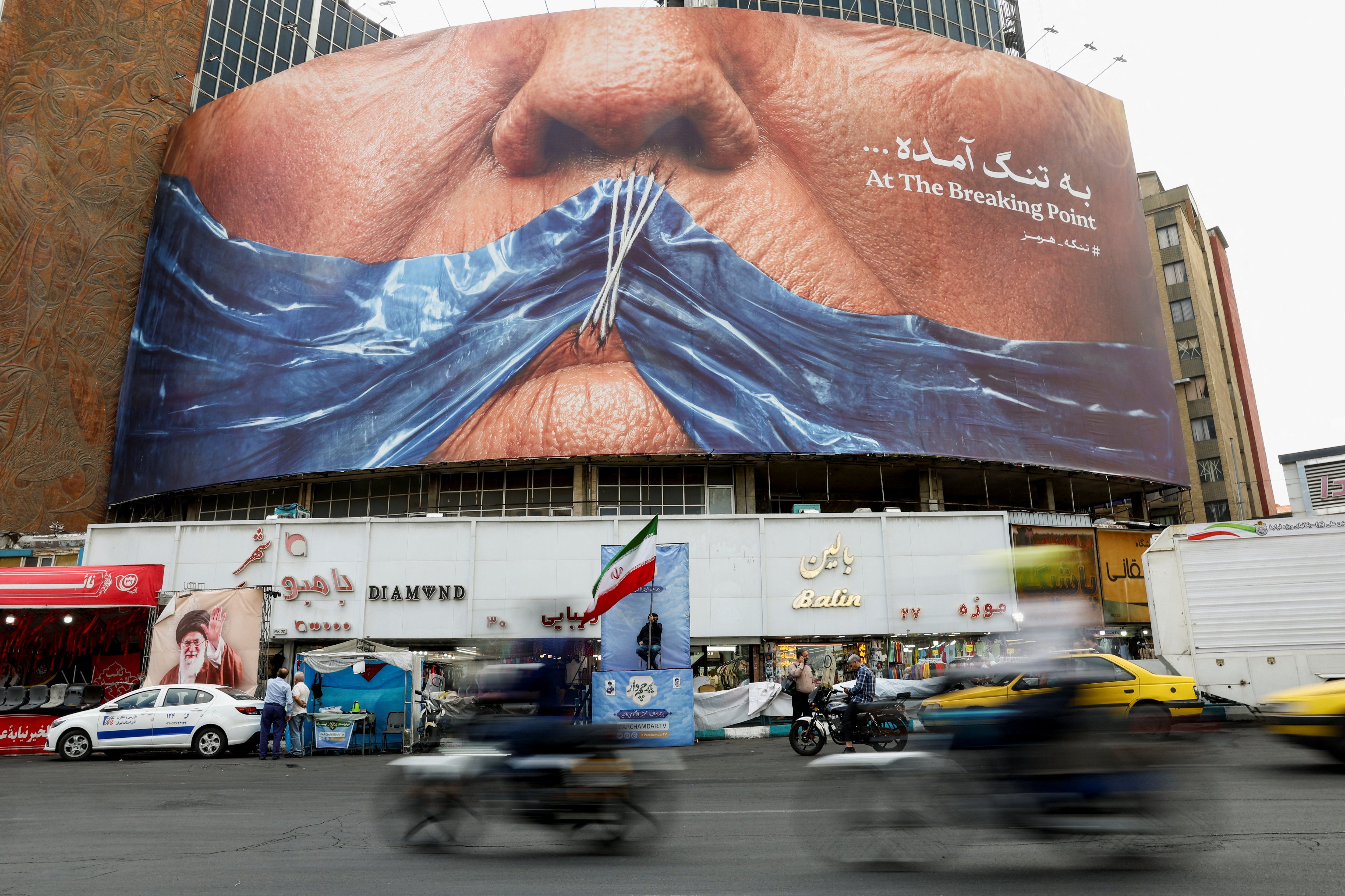 An anti-U.S. billboard depicting President Donald Trump and the Strait of Hormuz in Tehran