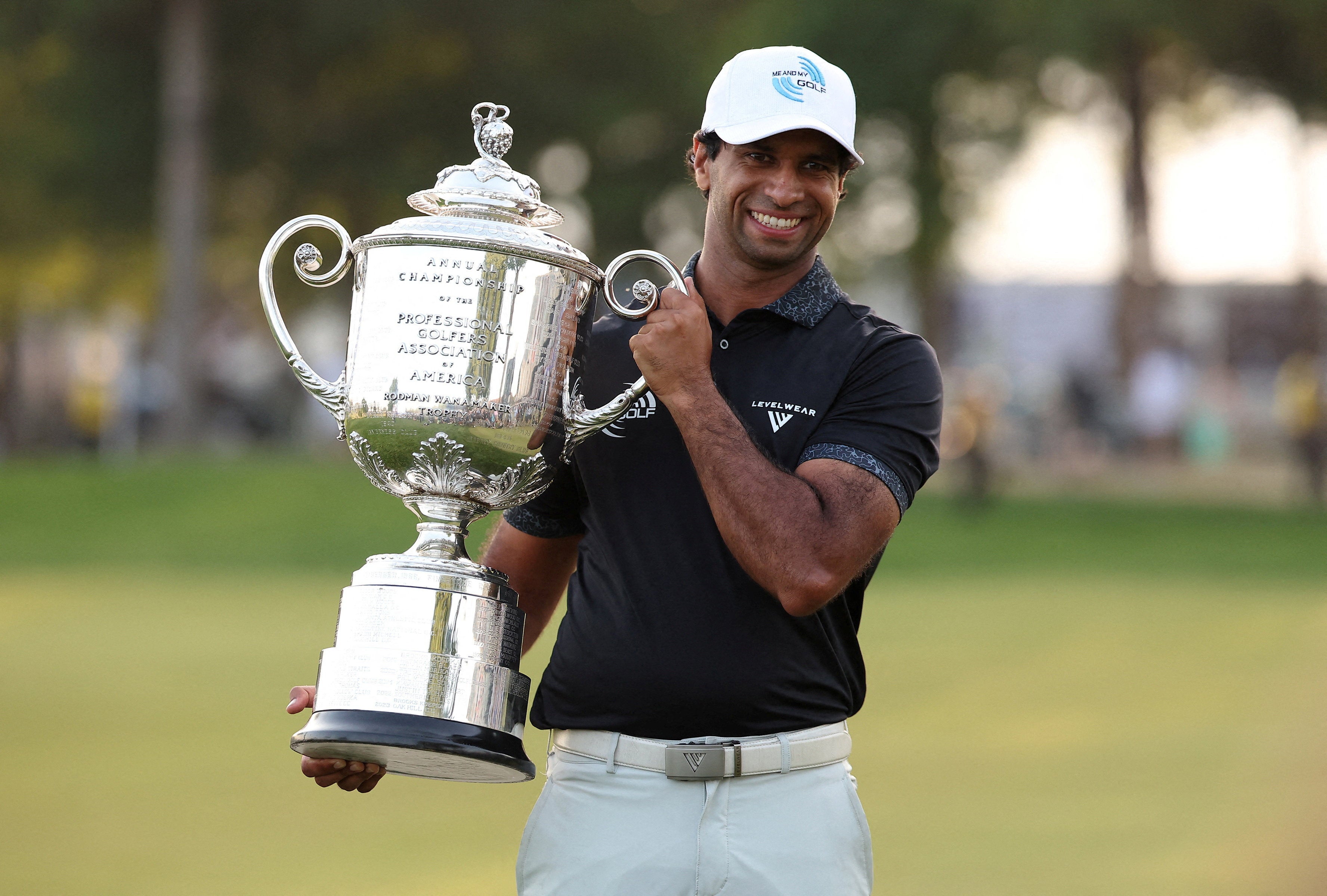 Rai poses with the trophy after claiming victory in the final round of the PGA Championship