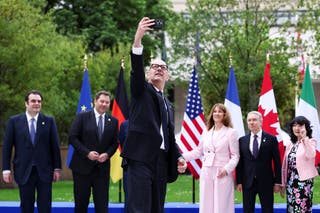 French Finance Minister Roland Lescure takes a selfie