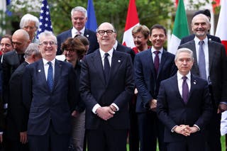 French Finance Minister Roland Lescure, Canadian Finance Minister Francois-Philippe Champagne and Banque de France Governor Francois Villeroy de Galhau pose with other attendees for a family photo on the day of a G7 finance ministers' and central bank governors' meeting in Paris