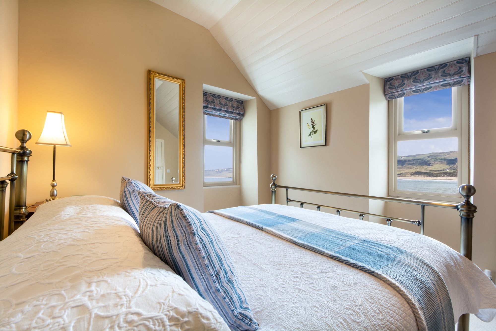 Take in views of the beach from bed at this cottage