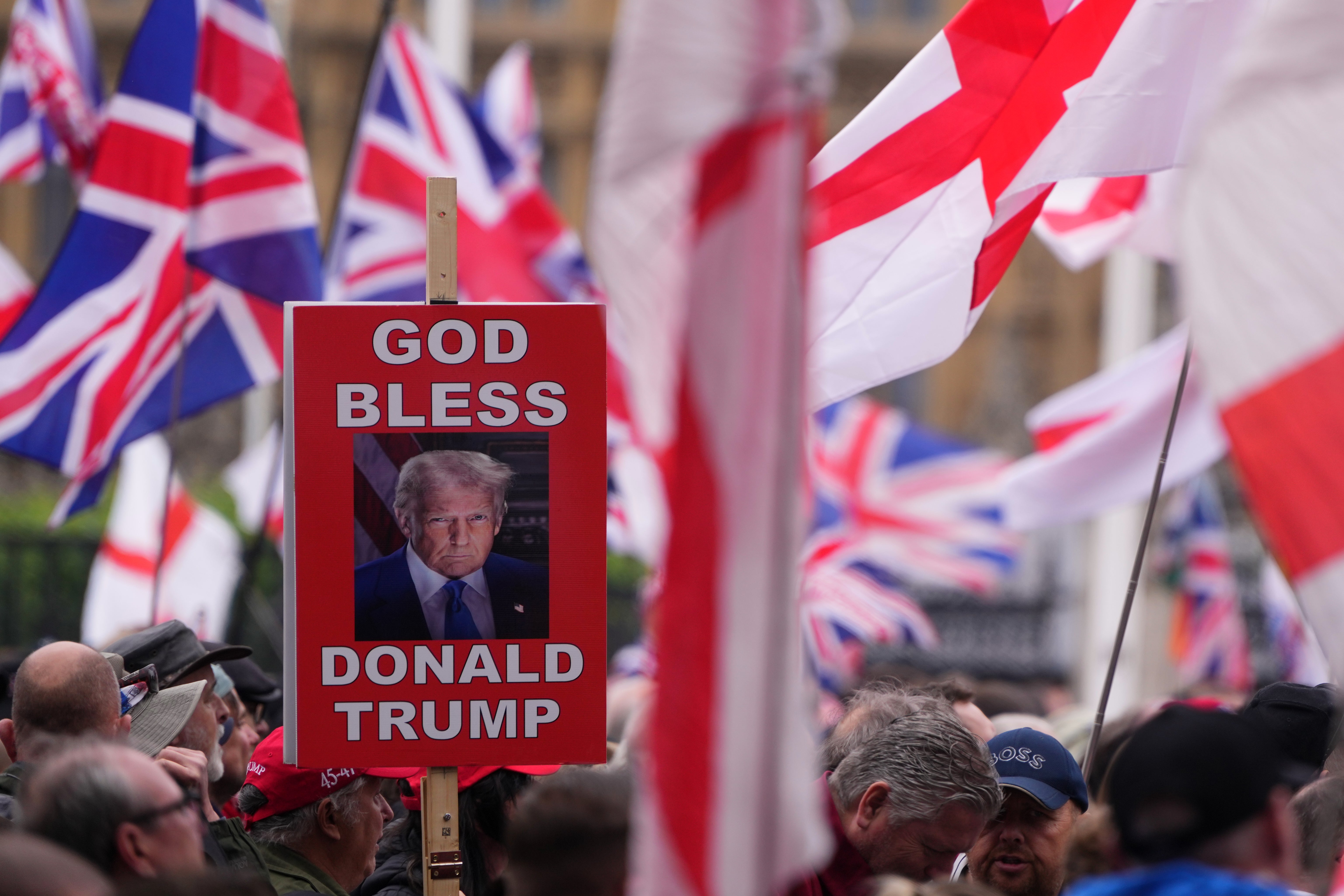 A protester holds a banner during the Unite the Kingdom march in London