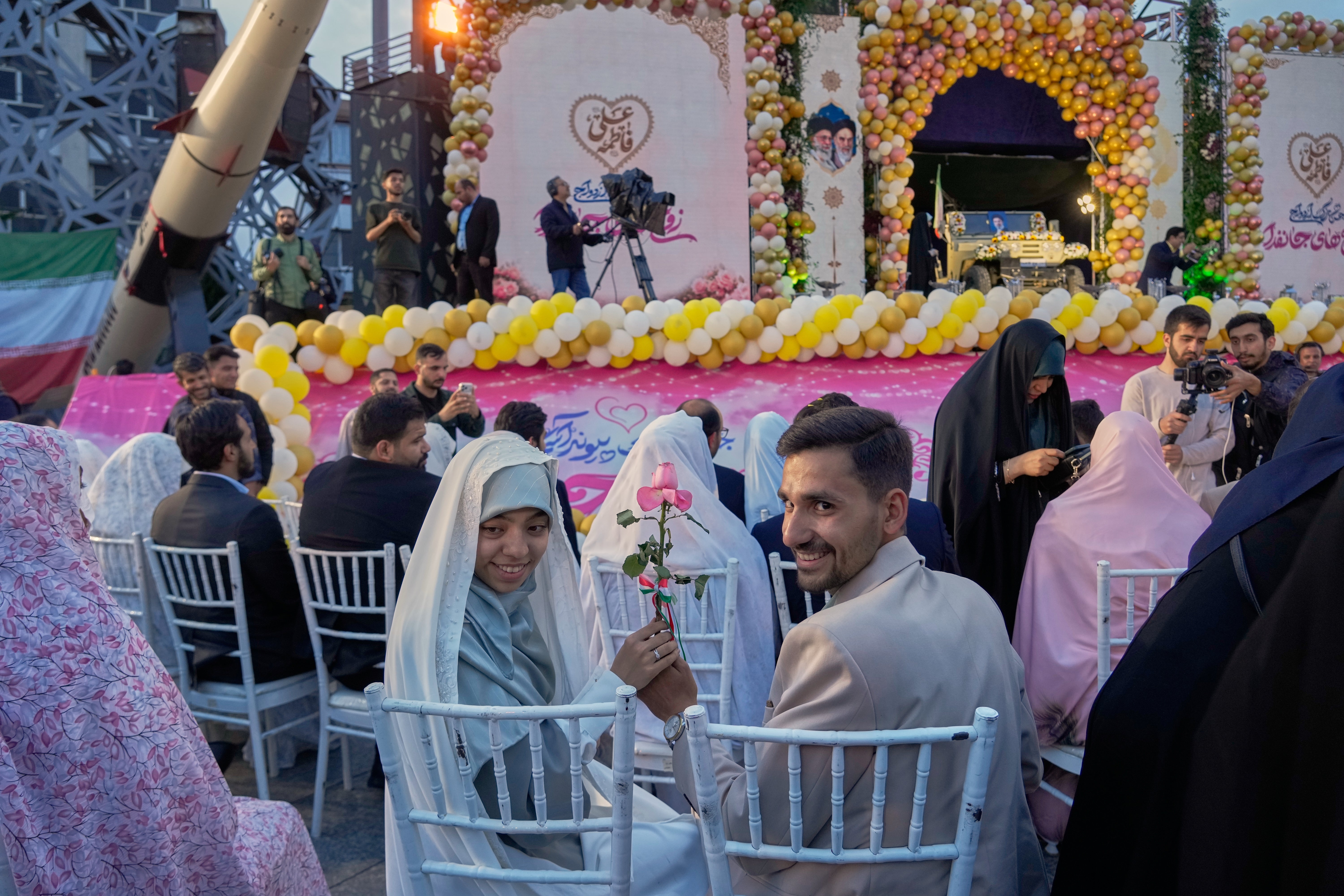 Photos of a mass wedding and a colorful missile at Tehran's 'Sacrifice for Iran' ceremony (Copyright 2026 The Associated Press. All rights reserved)