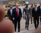 Trump posts AI photo of himself with buff alien in latest Truth Social spree