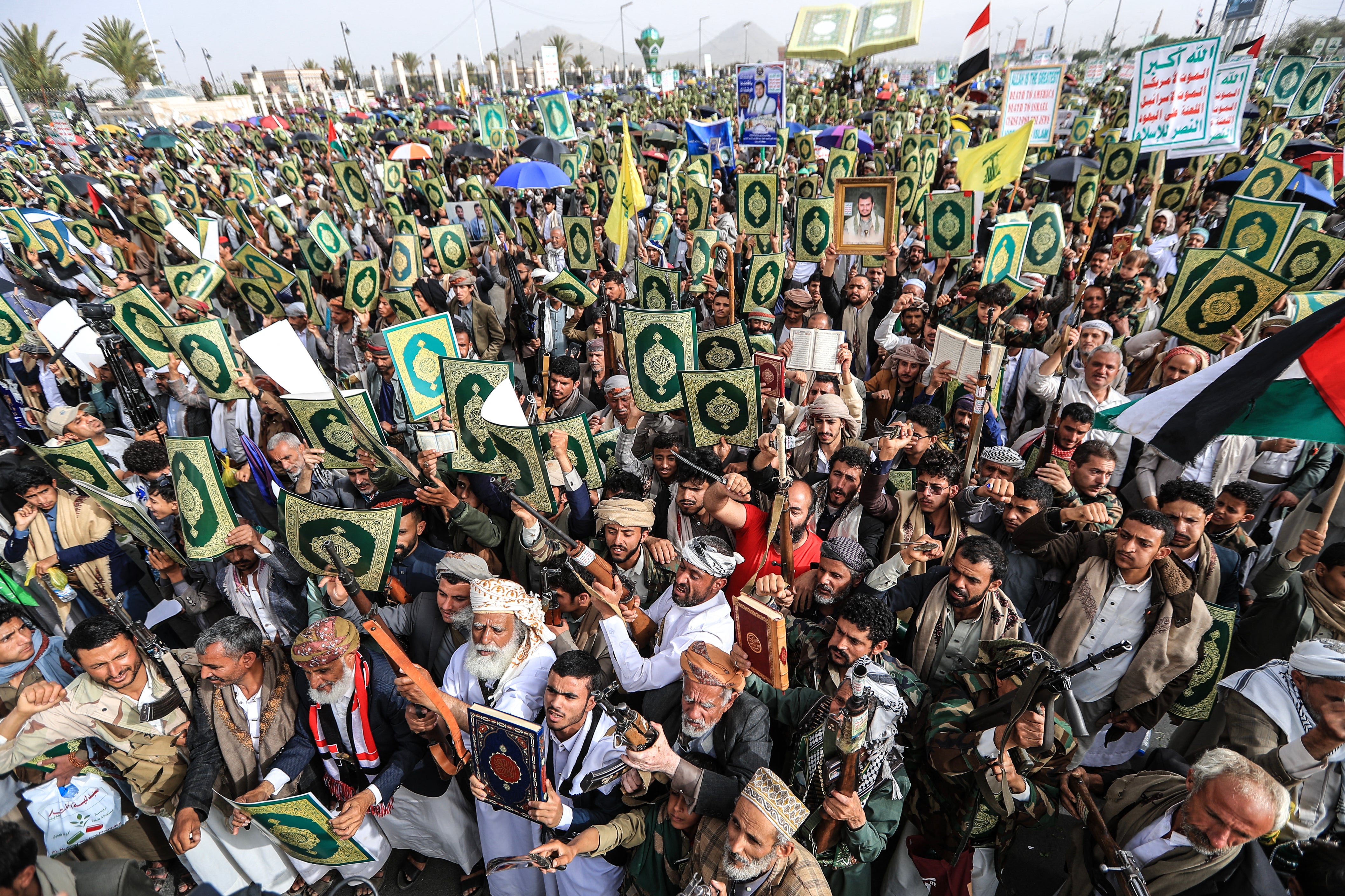 Supporters of the Iran-backed Houthi movement brandish weapons and copies of the Quran as they rally in solidarity with Lebanon in Sanaa on May 18, 2026 (AFP/Getty)