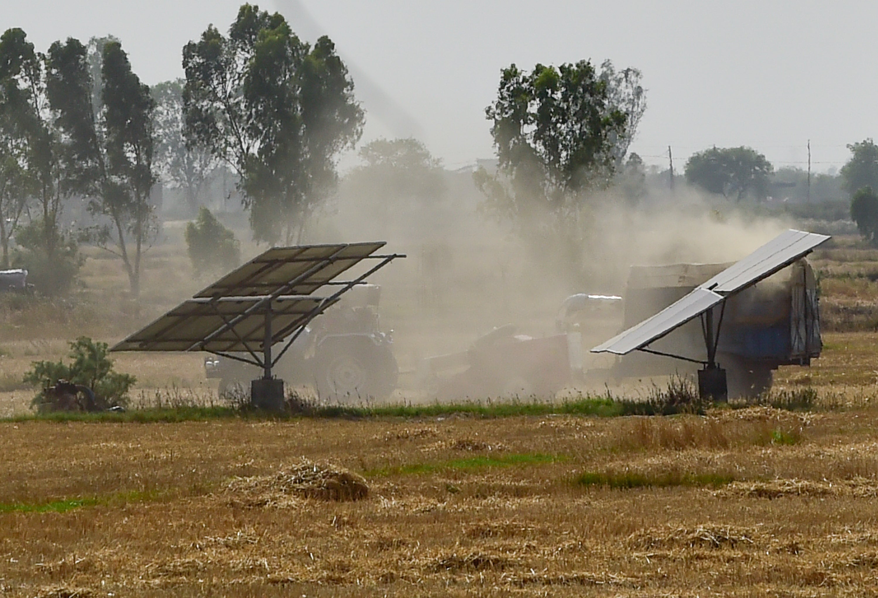 Solar panels are seen installed in an agriculture field in Haryana, India