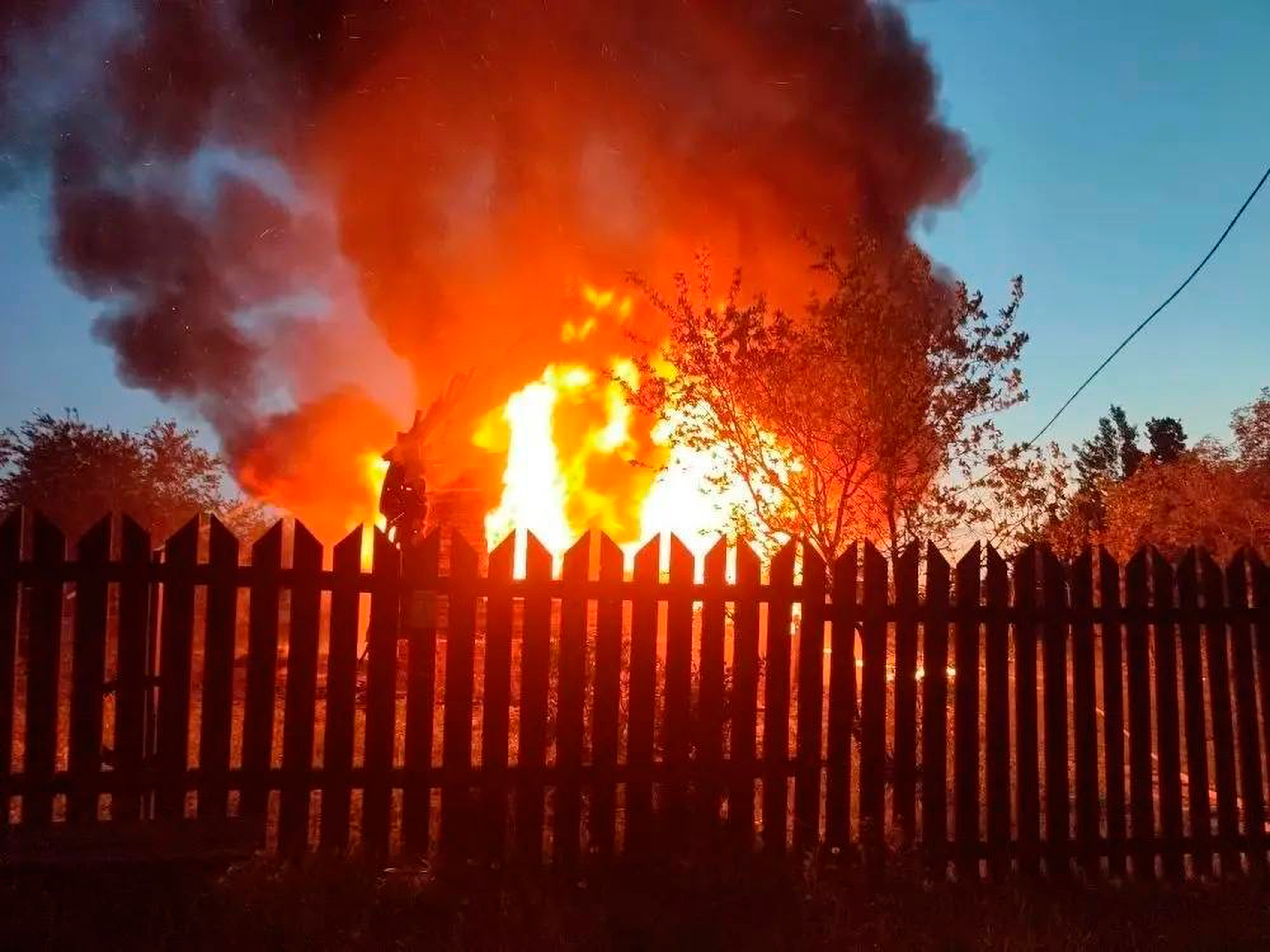 A house on fire after a Ukrainian attack in Khimki, just outside Moscow on Sunday (AP)