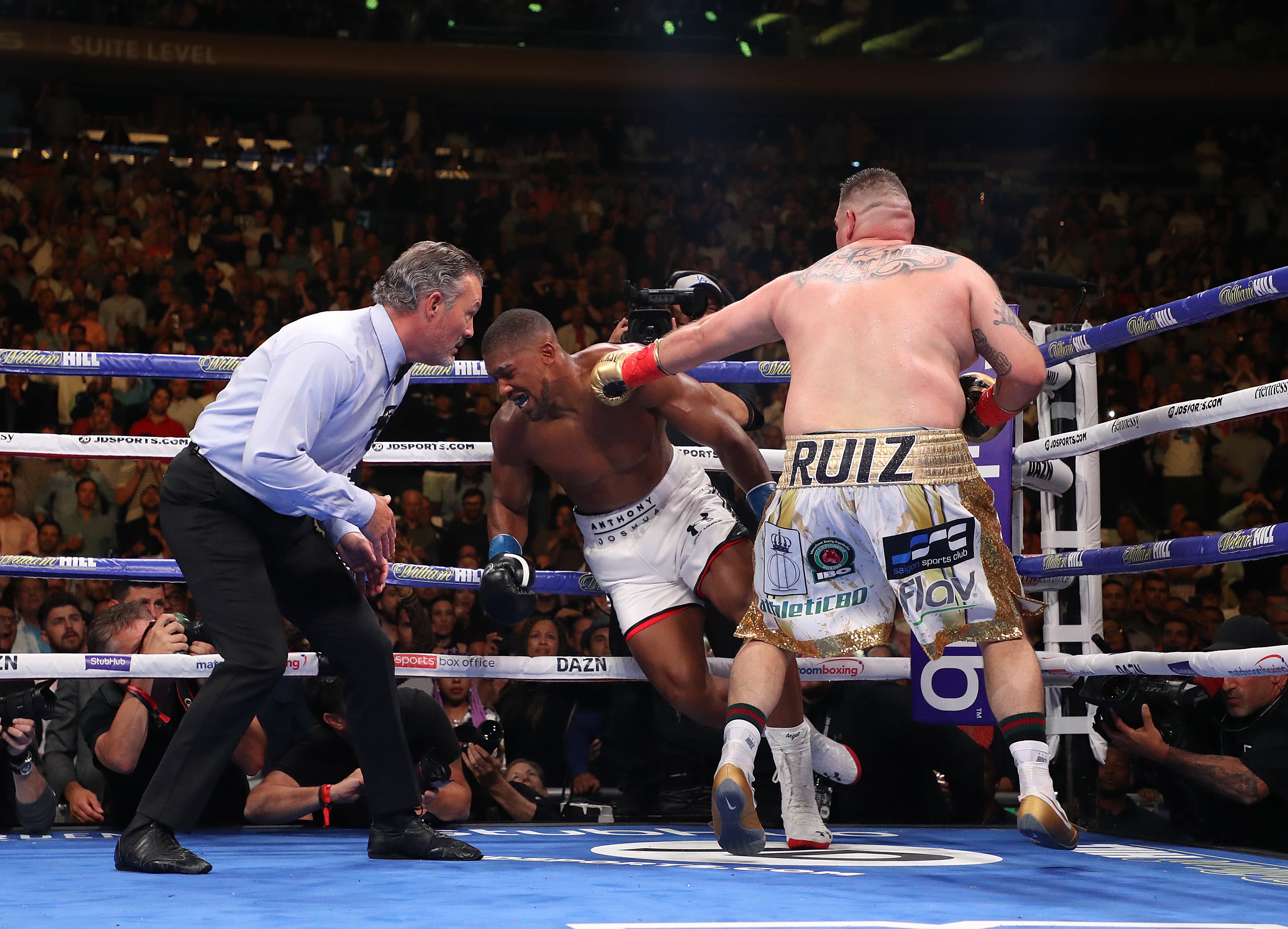 Anthony Joshua (centre) was stunned by Andy Ruiz Jr in 2019 before avenging the defeat
