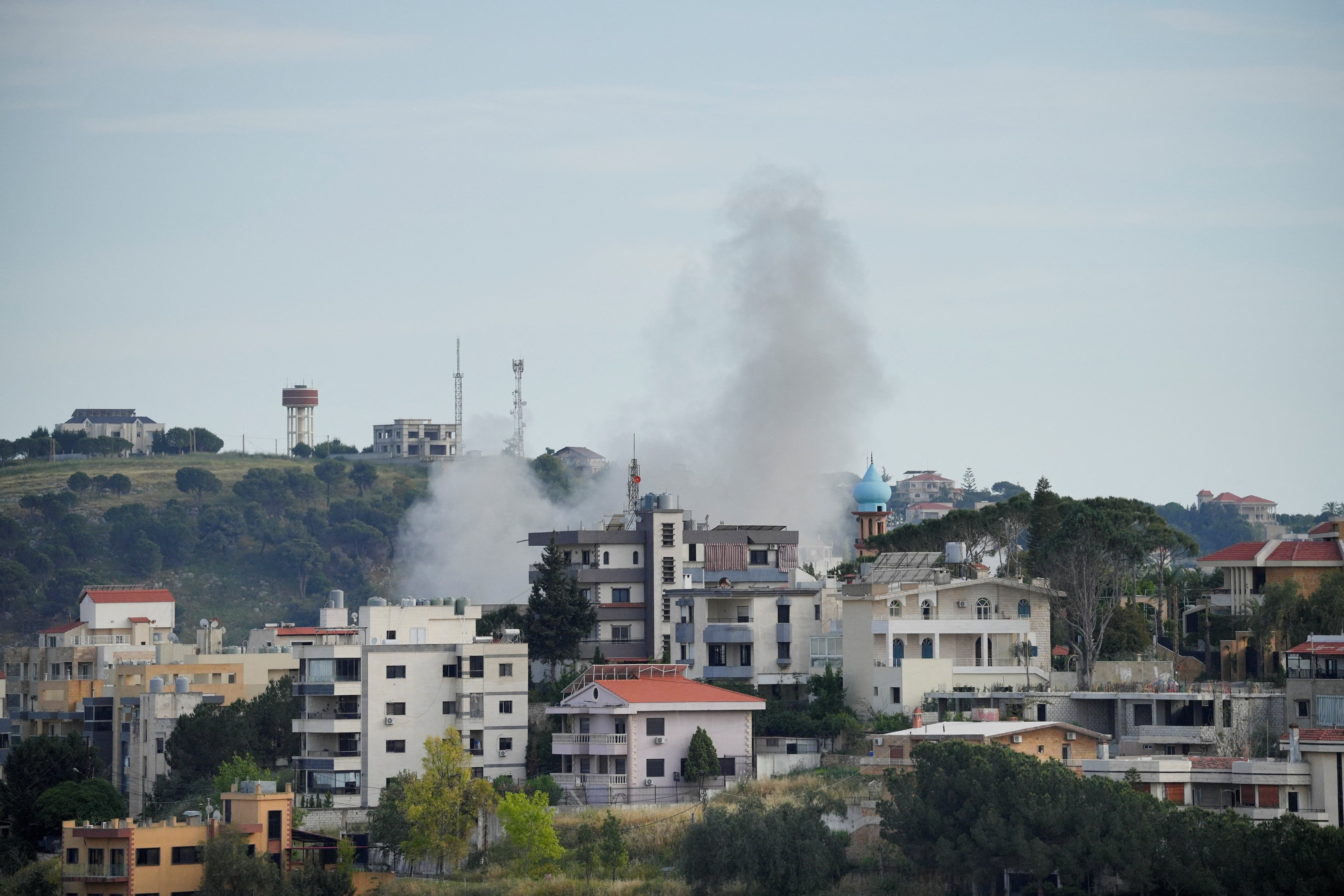 Smoke billows following Israeli strikes, in Nabatieh (Reuters)