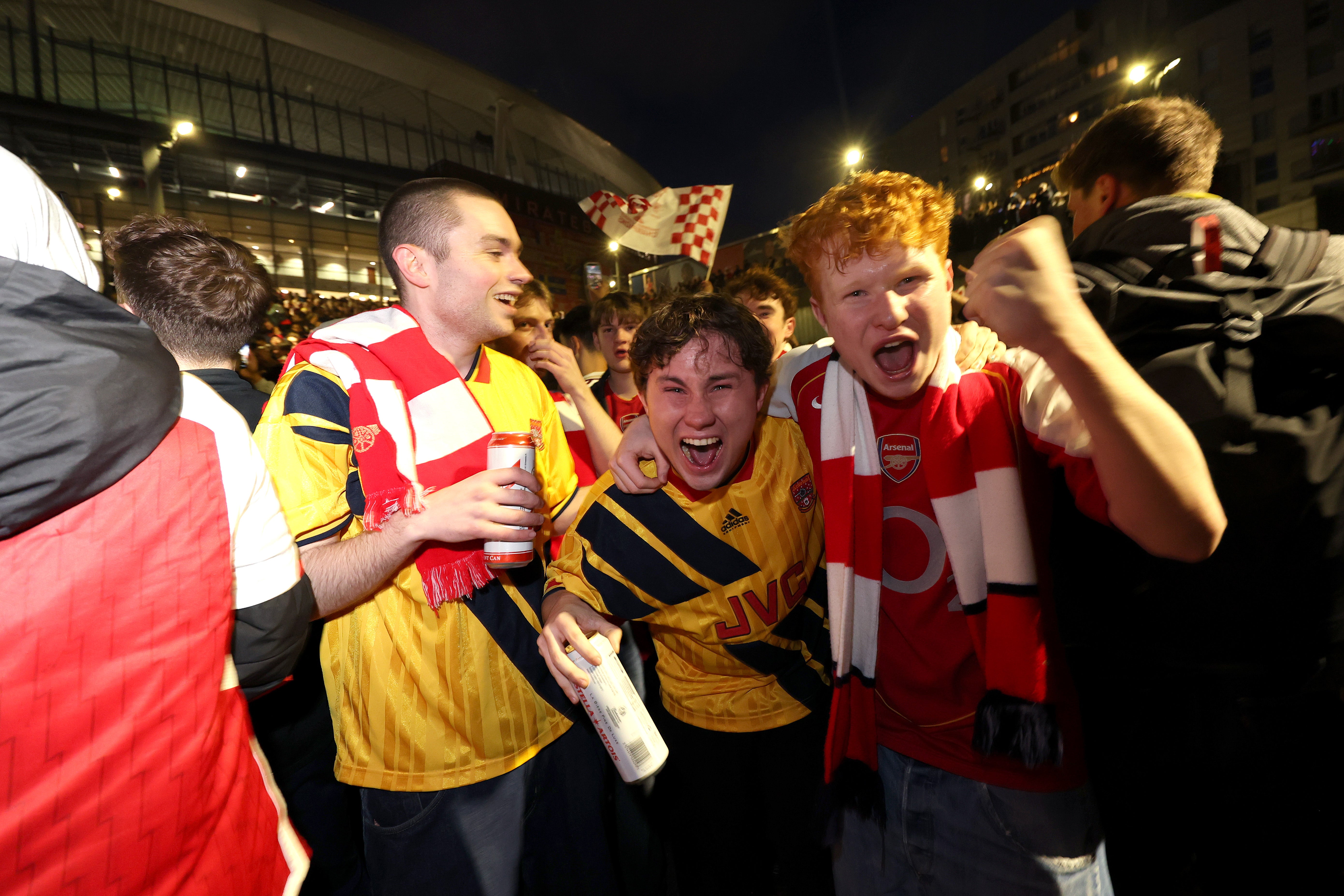 Arsenal fans celebrate outside of Emirates Stadium