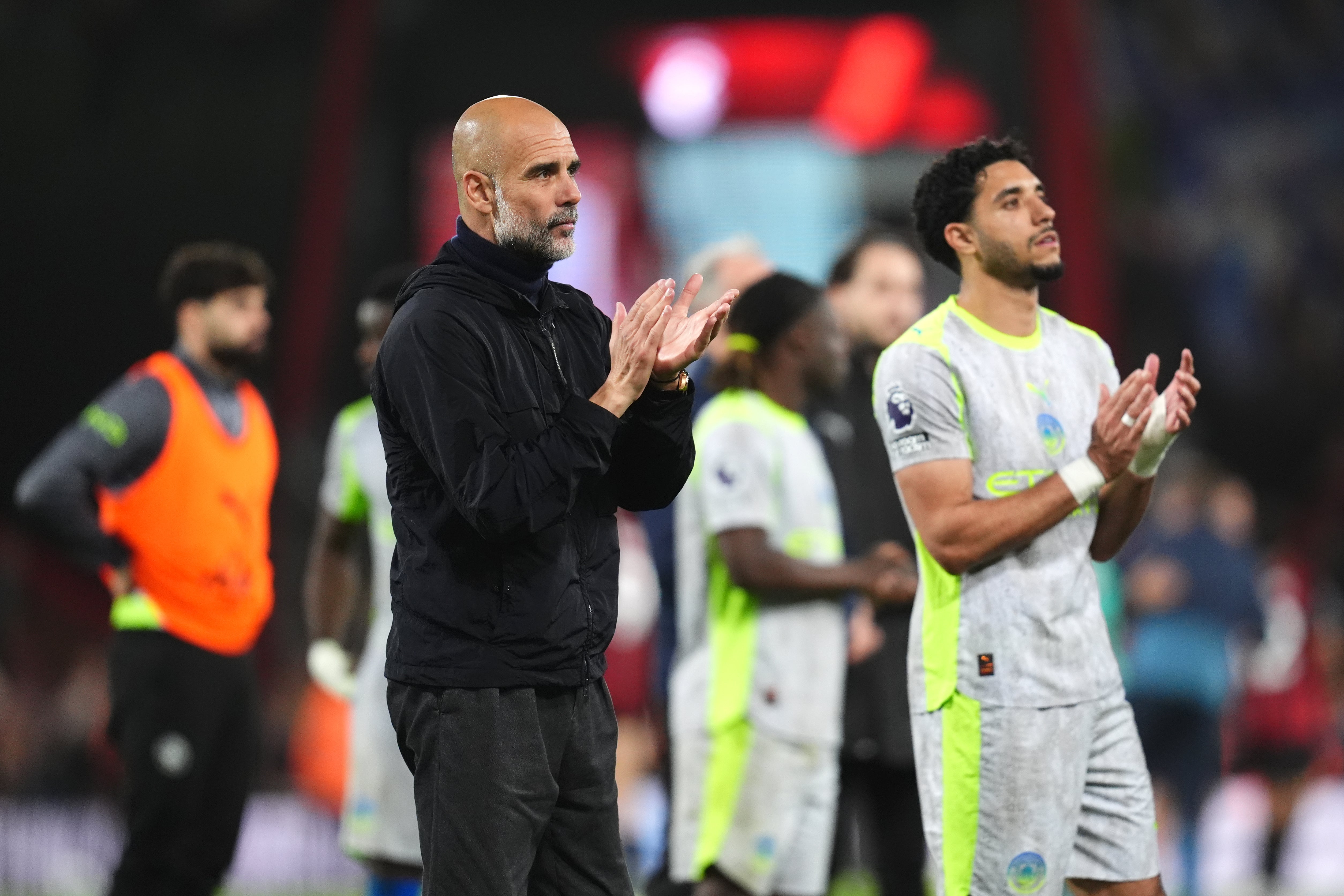 Pep Guardiola (left) and players applaud the fans (John Walton/PA) (PA Wire)
