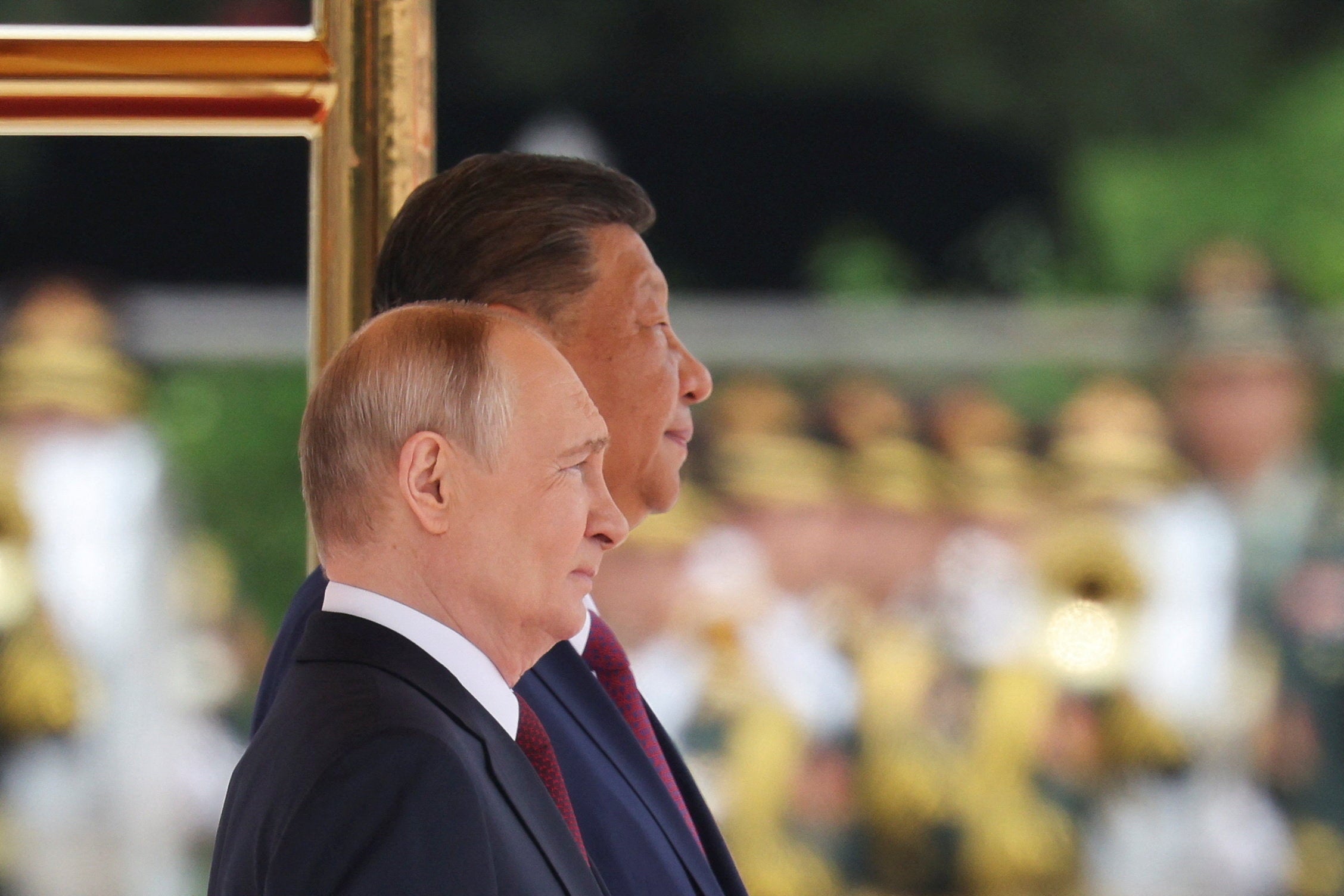 Russian president Vladimir Putin and Chinese president Xi Jinping during a welcoming ceremony at the Great Hall of the People in Beijing (Reuters)