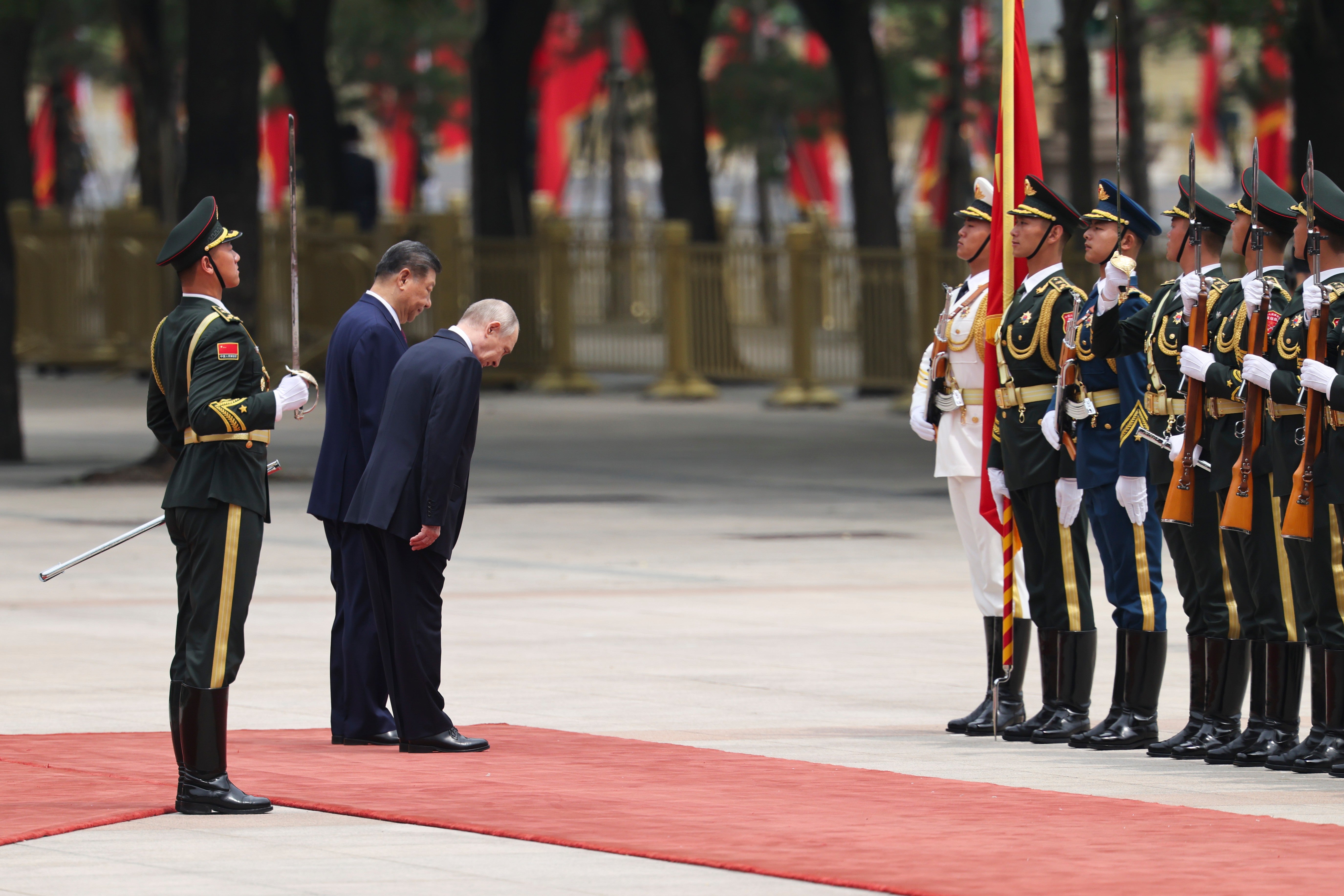 Putin and Xi inspect an honor guard during a welcoming ceremony at the Great Hall of the People in Beijing (AP)