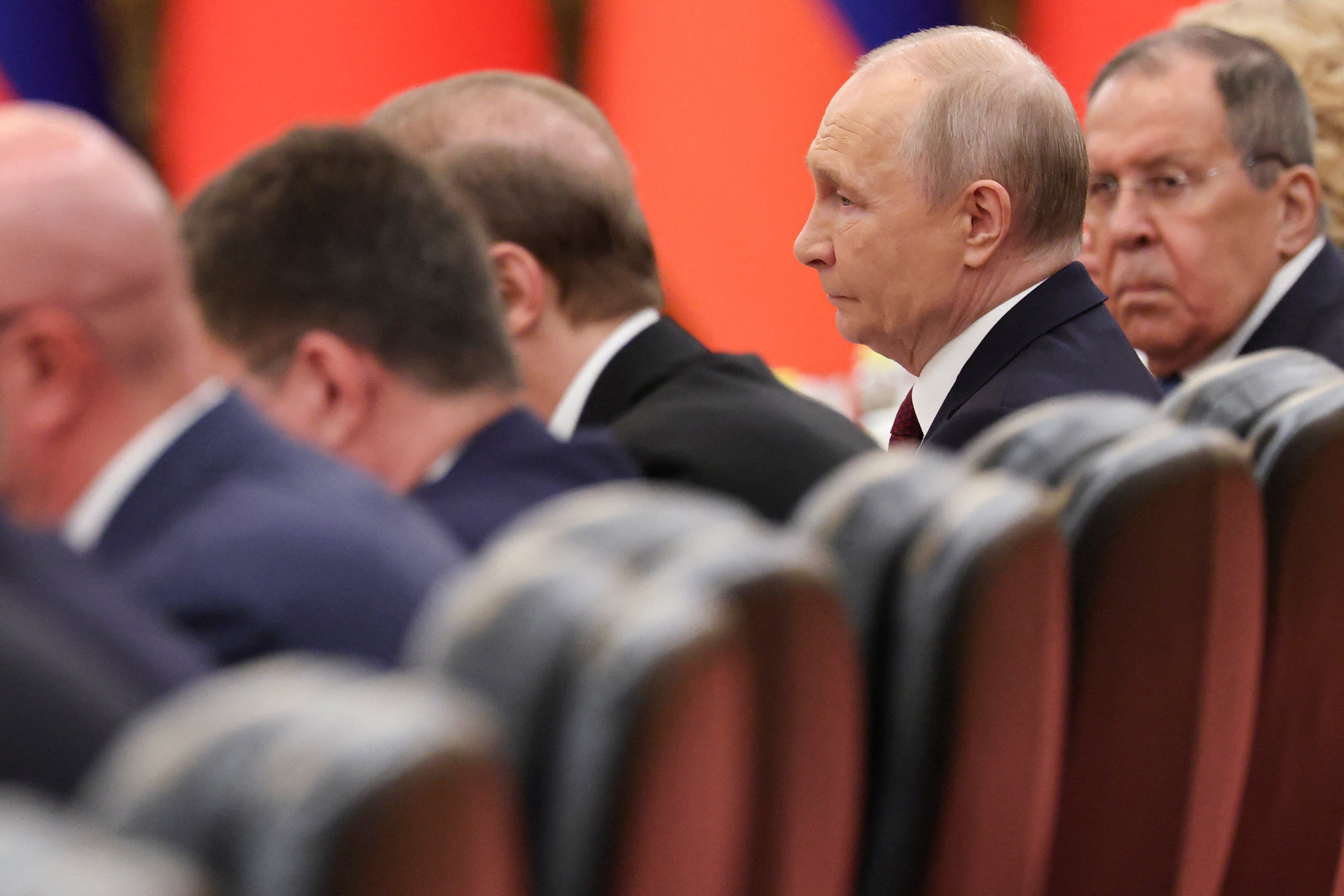 Russian president Vladimir Putin, alongside foreign minister Sergei Lavrov, attends a bilateral meeting with Chinese president Xi Jinping (not pictured) at the Great Hall of the People in Beijing (Reuters)