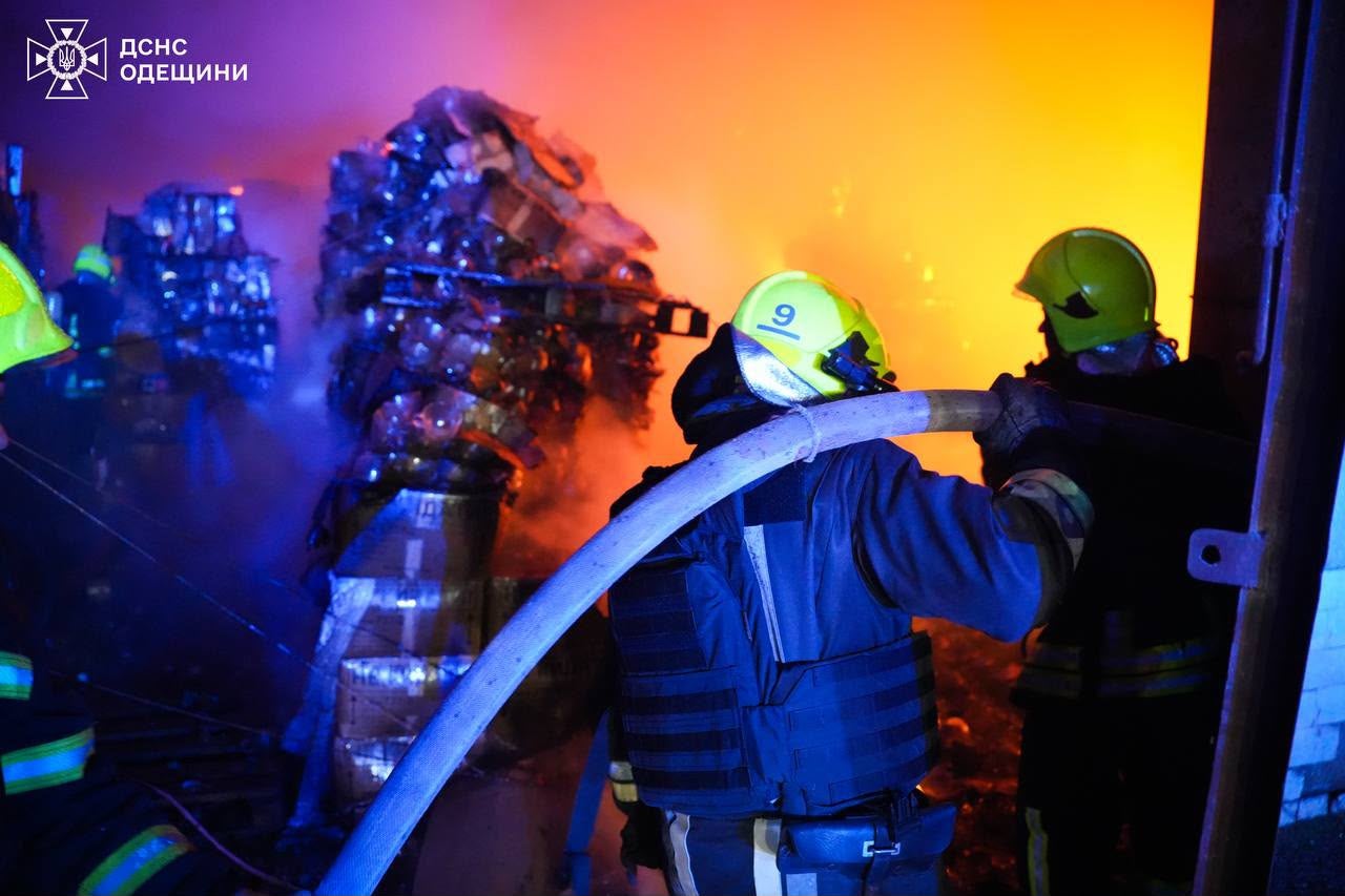 Rescue workers put out a fire inside a storage facility after a Russian strike on Odesa region on May 20