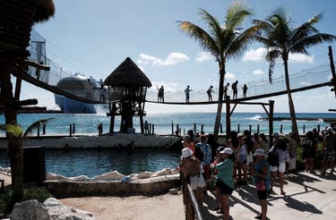 <p> Tourists enjoy amenities at the Costa Maya Cruise Port after the arrival of Royal Caribbean's Icon of the Seas, the largest cruise ship in the world, in the village town of Mahahual, Quintana Roo state, Mexico, February 6, 2024. REUTERS/Paola Chiomante/File Photo</p>