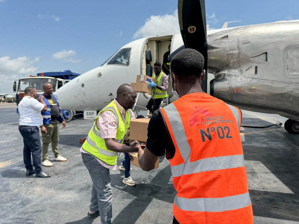 A Medecins Sans Frontieres (MSF) cargo flight is unloaded at Bunia airport with emergency response supplies