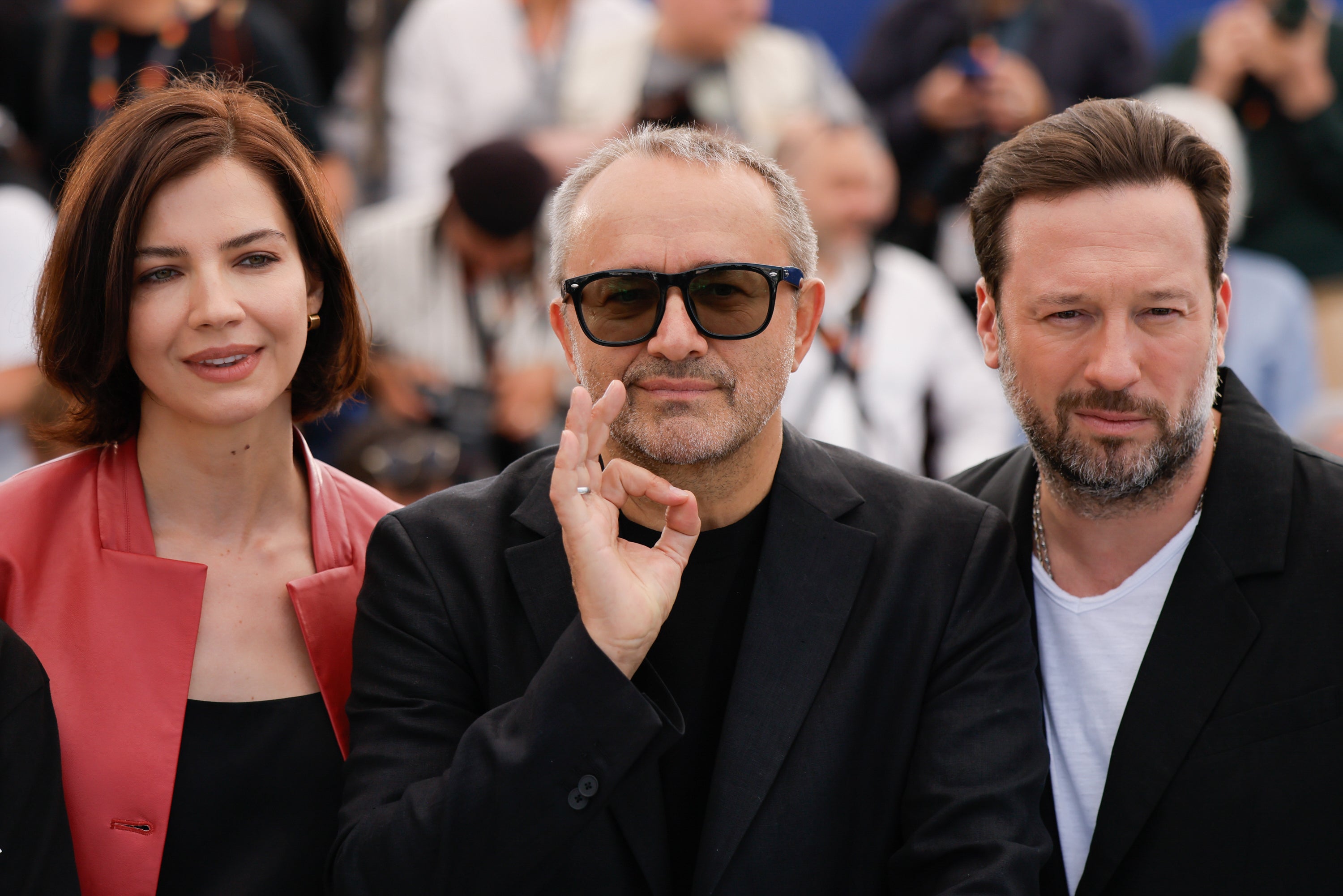 Iris Lebedeva, director Andrey Zvyagintsev and Dmitriy Mazurov pose for photographers at the photo call for the film ‘Minotaur' at the 79th international film festival, Cannes, southern France, Wednesday, May 20, 2026.