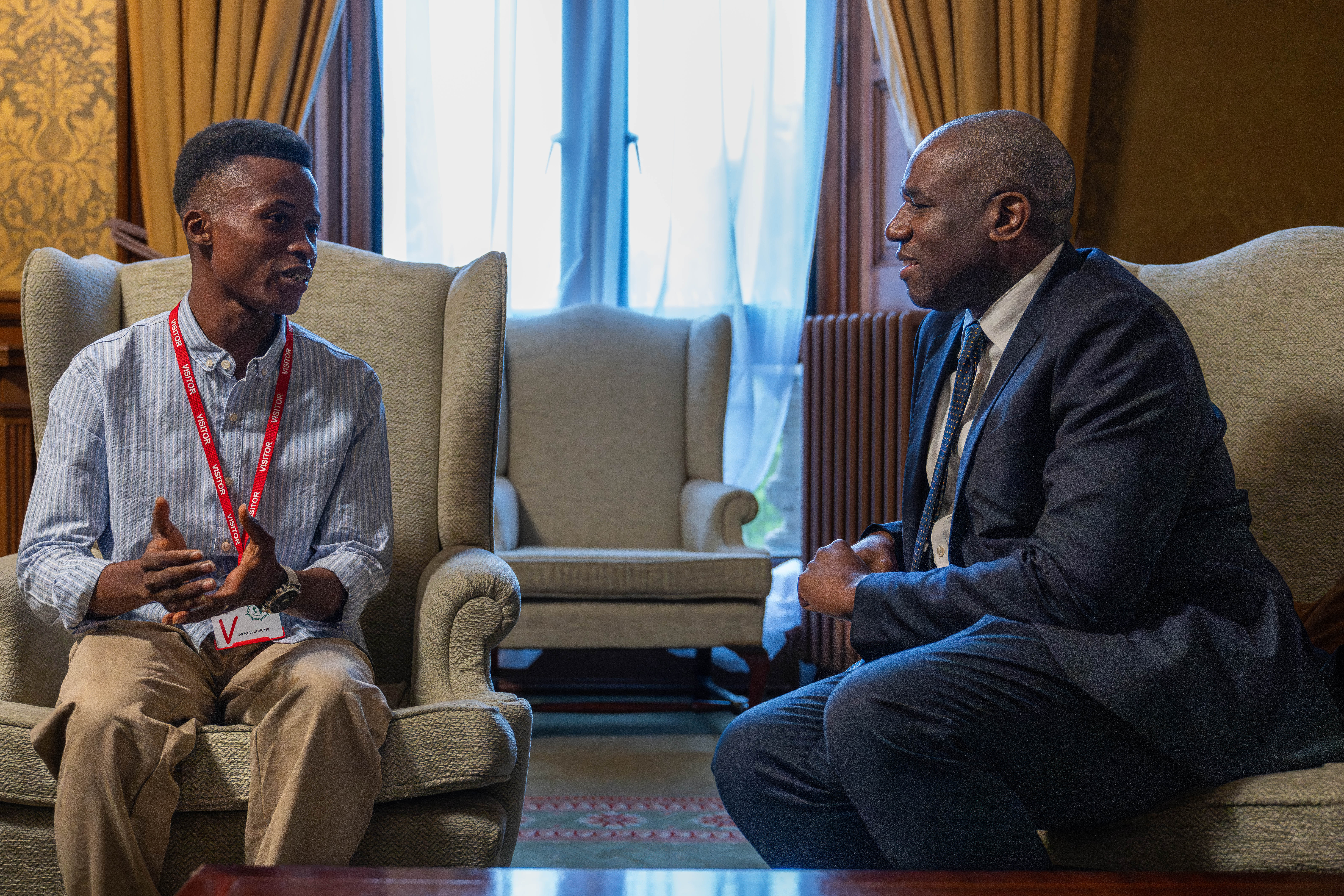 David Lammy meets with youth advocate Mohamed Williams Zombo, who told The Independent at the Global Partnerships Conference how aid cuts have devastated his hometown of Bo in Sierra Leone (Department of Justice)