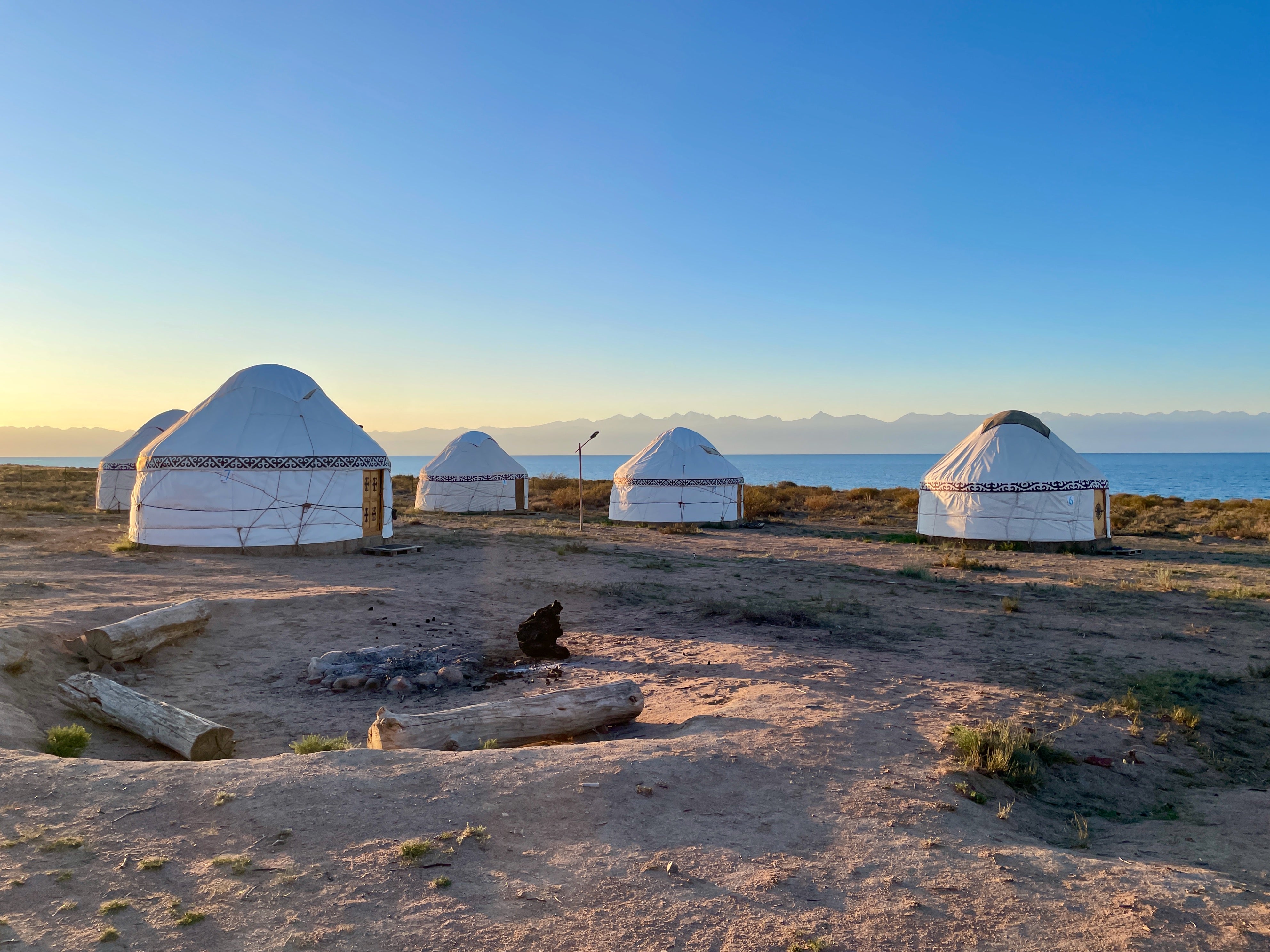 Traditional yurts on a sandy beach at Lake Issyk-KulGenghis Khan monument in Tov province of mongolia in Kyrgyzstan