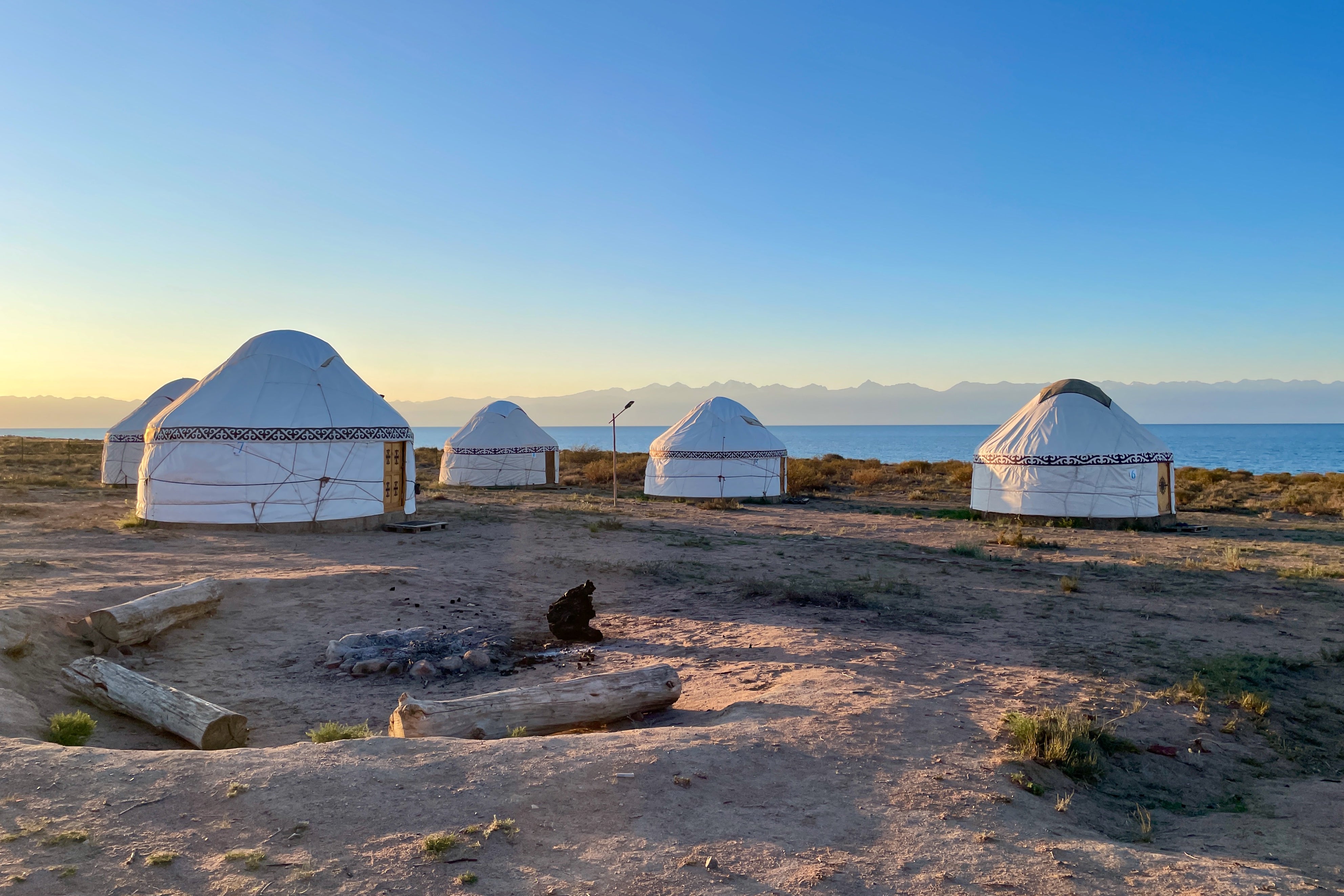 Traditional yurts on a sandy beach at Lake Issyk-KulGenghis Khan monument in Tov province of mongolia in Kyrgyzstan (Getty Images)