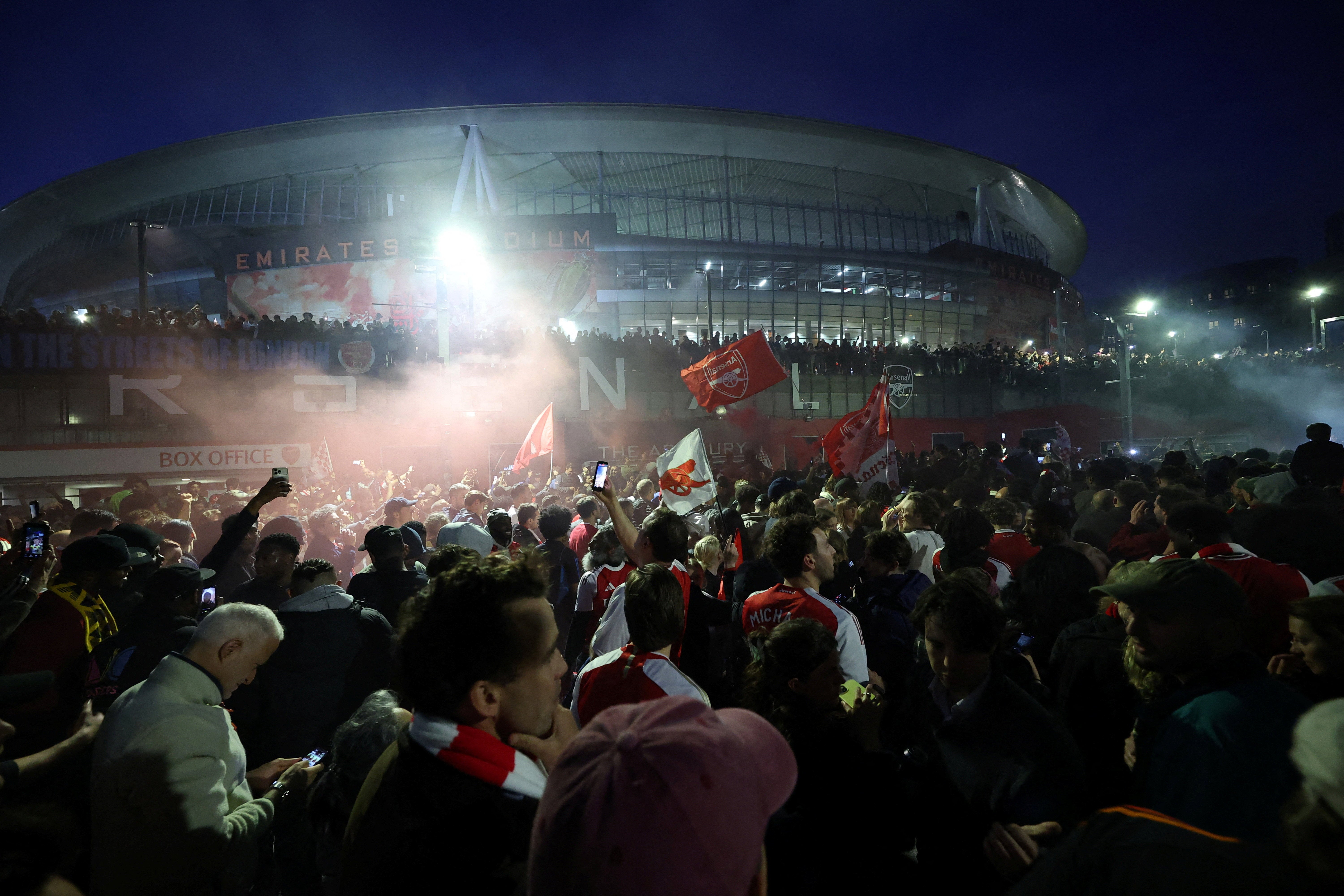 Arsenal players and fans partied long into the night (Reuters)