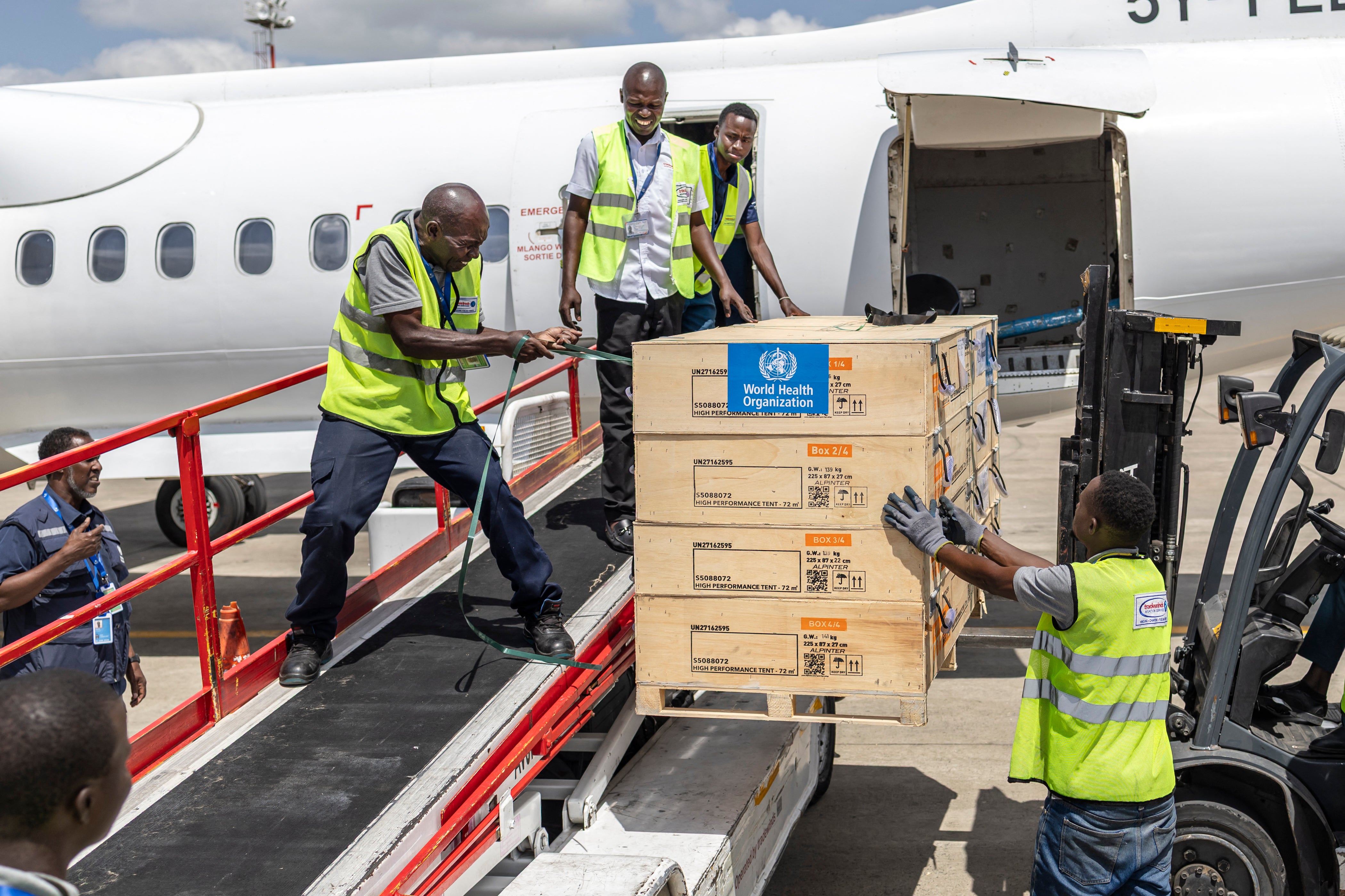 Ground crew load medical supplies onto a United Nations Humanitarian Air Service-operated charter plane bound for Bunia in the DRC