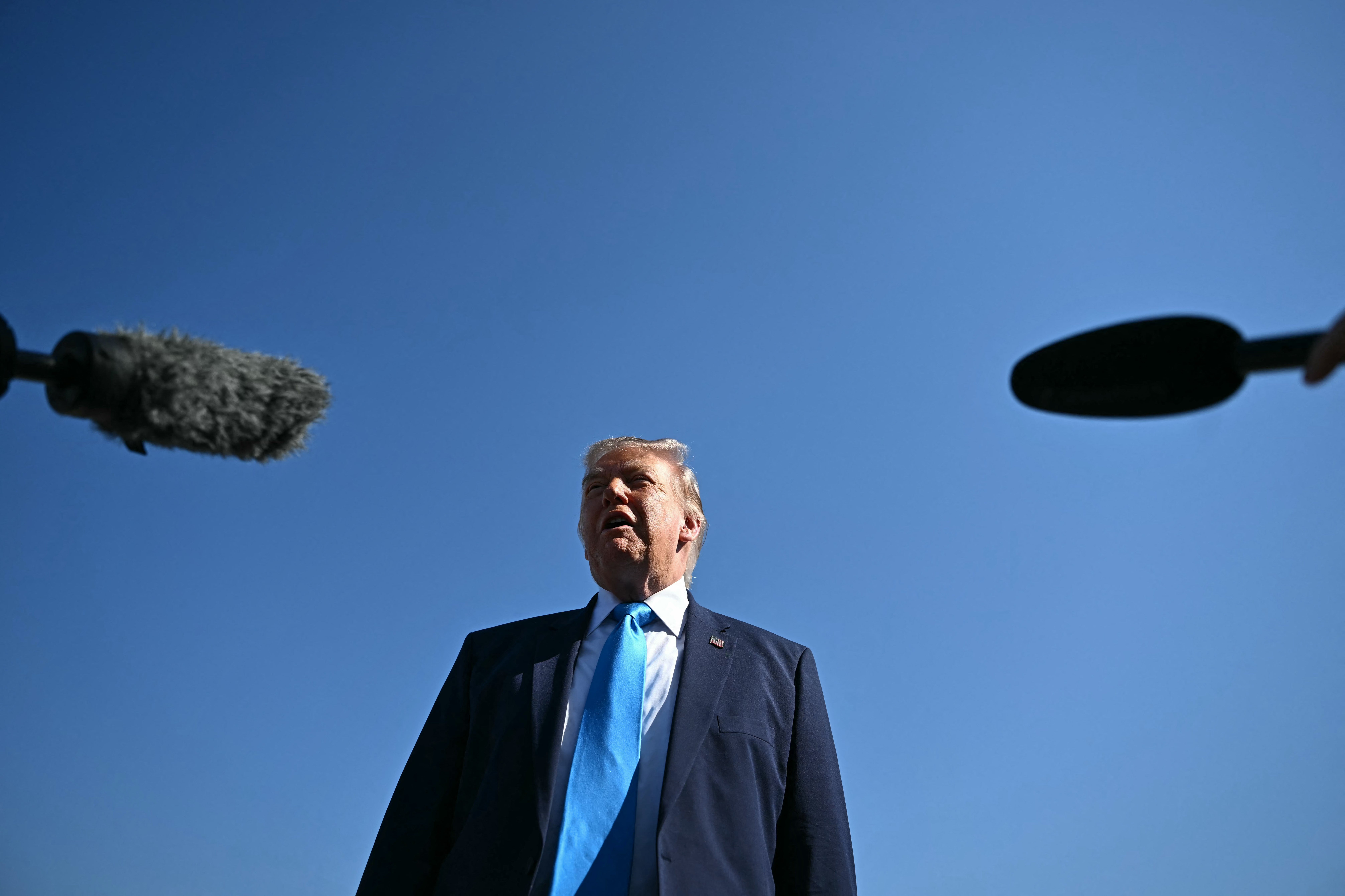 The president has defended his stock purchases, saying they are carried out by third-party financial institutions without his involvement