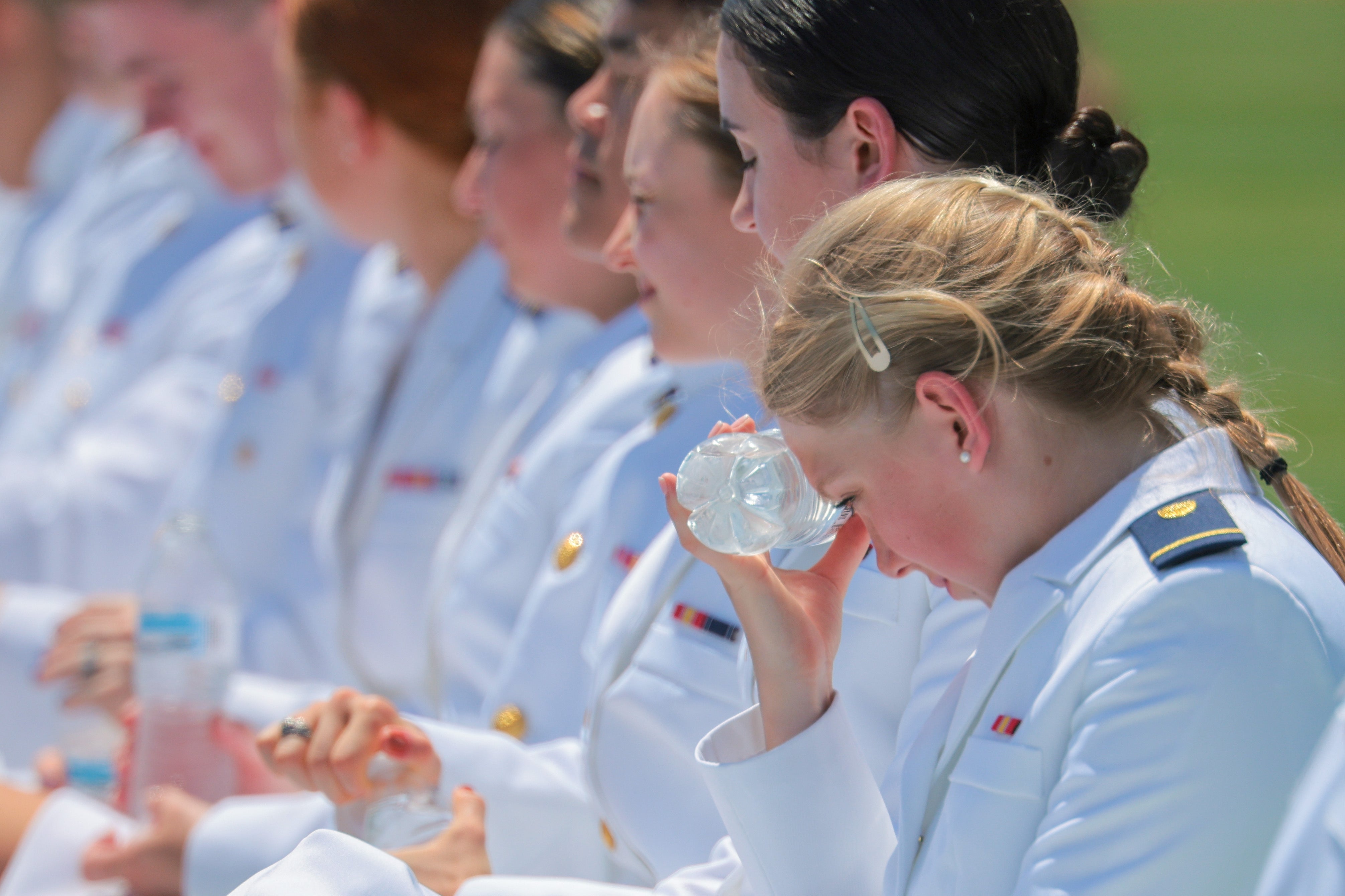 A cadet attempts to stay cool as President Donald Trump delivers the commencement address during the United States Coast Guard Academy commencement ceremony in New London, Connecticut, on Wednesday. (Getty)