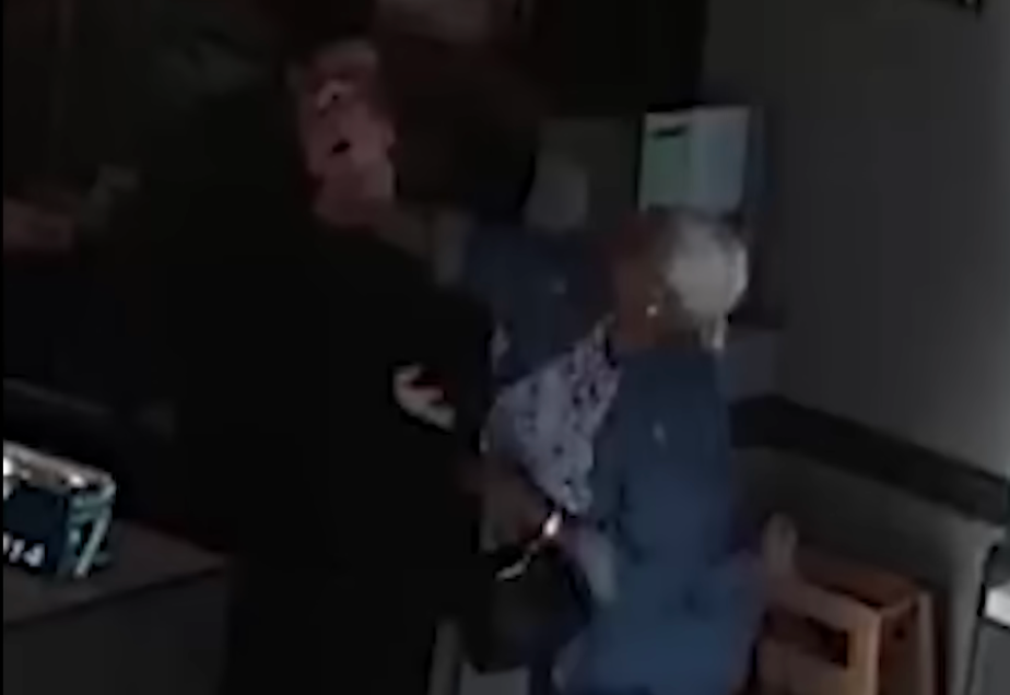 In the footage Grayson can be seen pushing the shift lead before hitting her in the face. The shift lead then leaps towards the elderly woman swinging her arms and causing the pair to fall to the ground