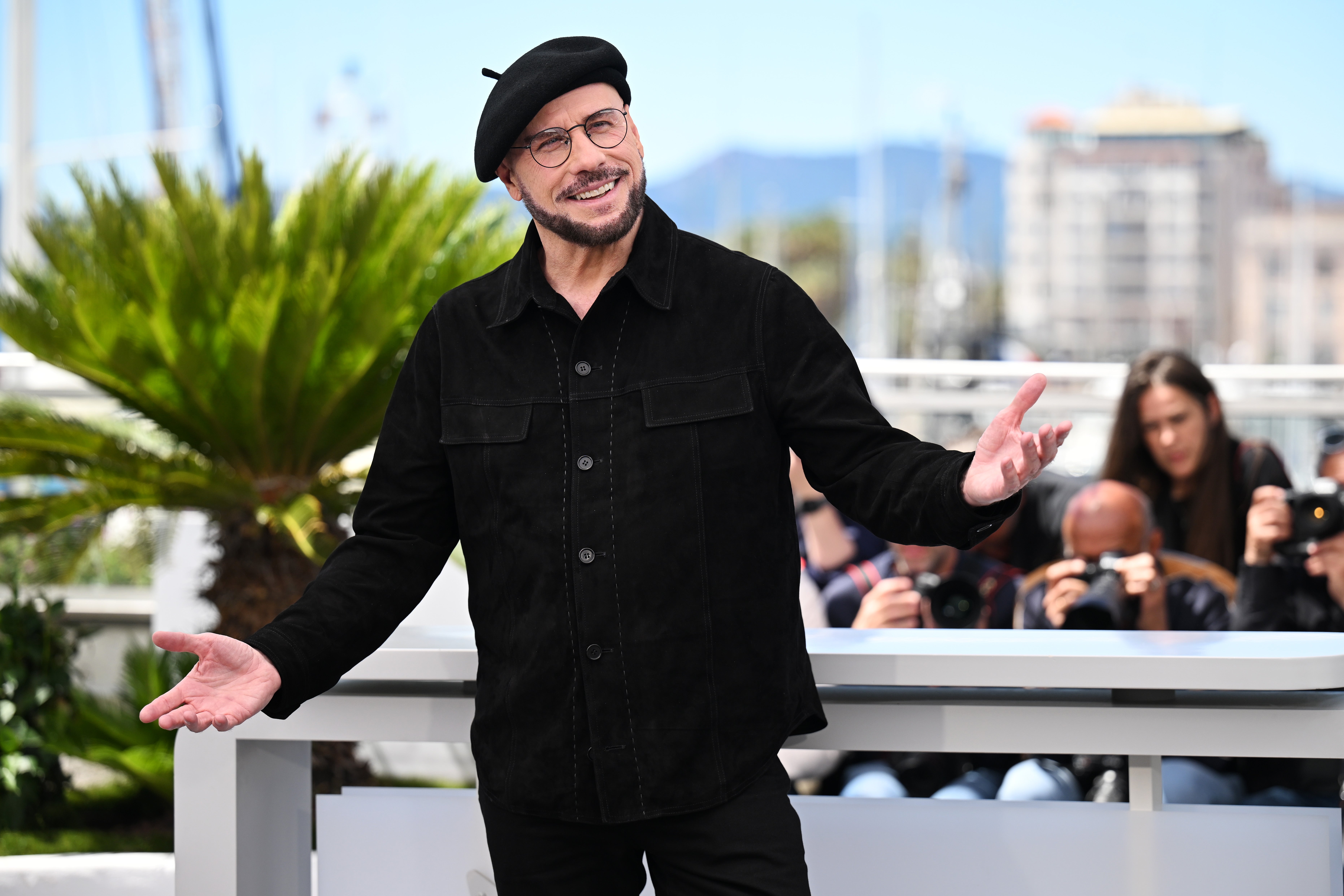 The ‘Grease’ star was presented with a prestigious Cannes Palme d’Or for his directorial debut