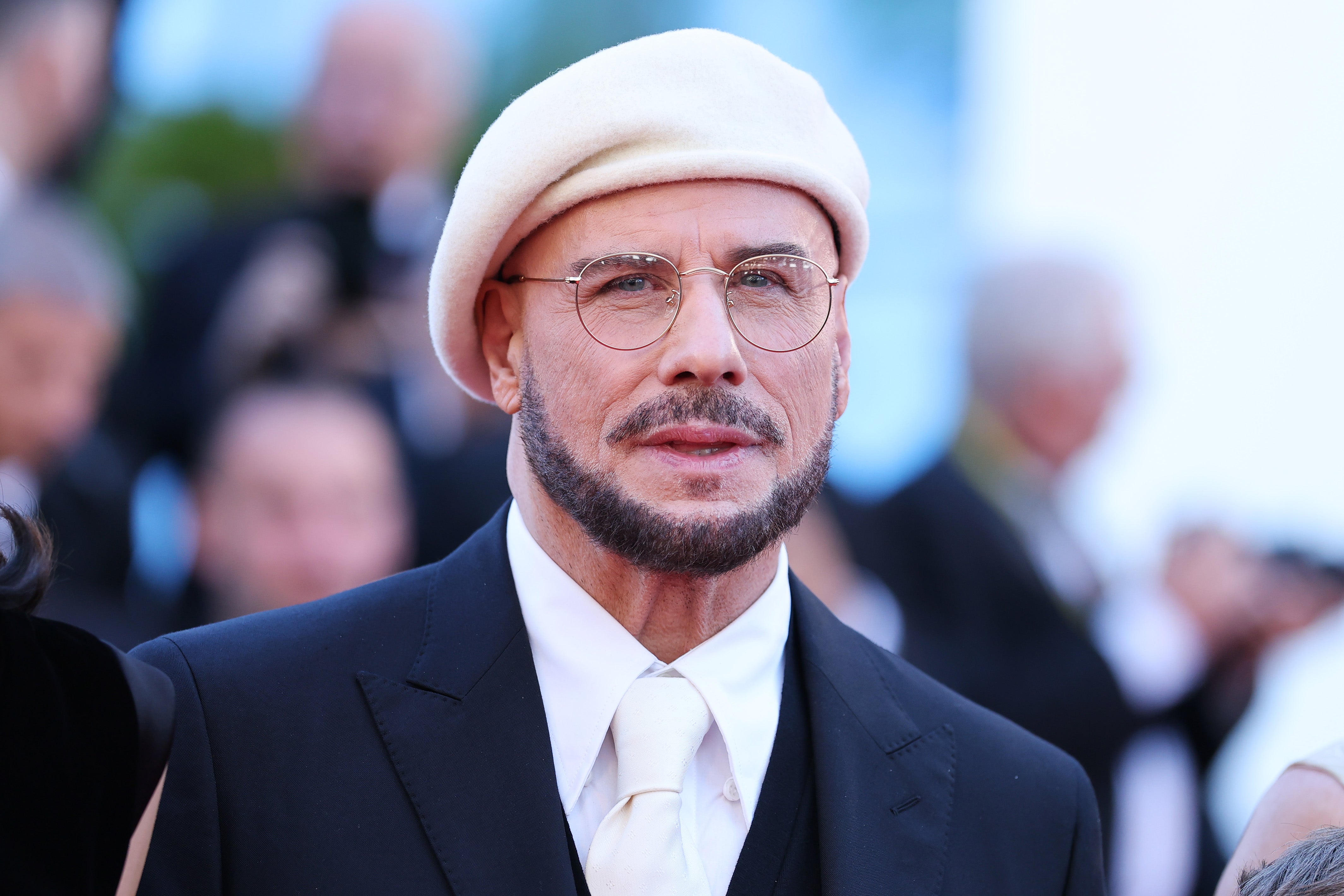 John Travolta unveiled his dramatic new look at Cannes Film Festival this week, where he is showcasing his directorial debut, ‘Propeller One-Way Night Coach’