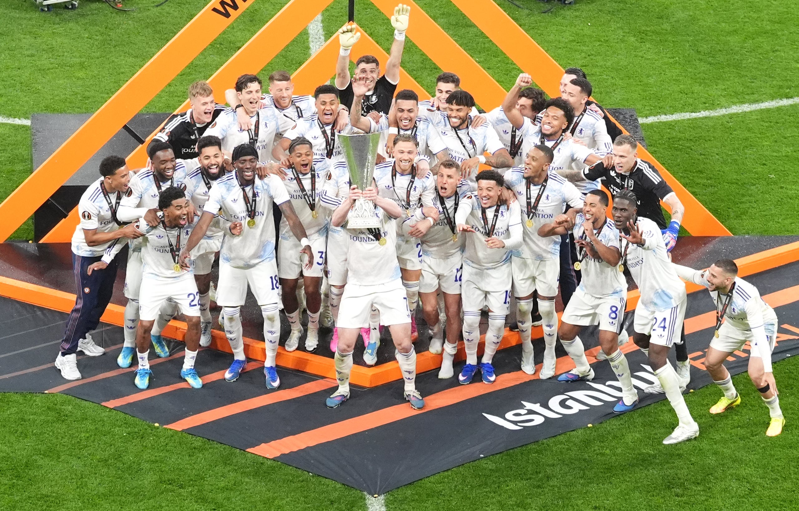 John McGinn (centre) lifts the trophy (Adam Davy/PA) (PA Wire)