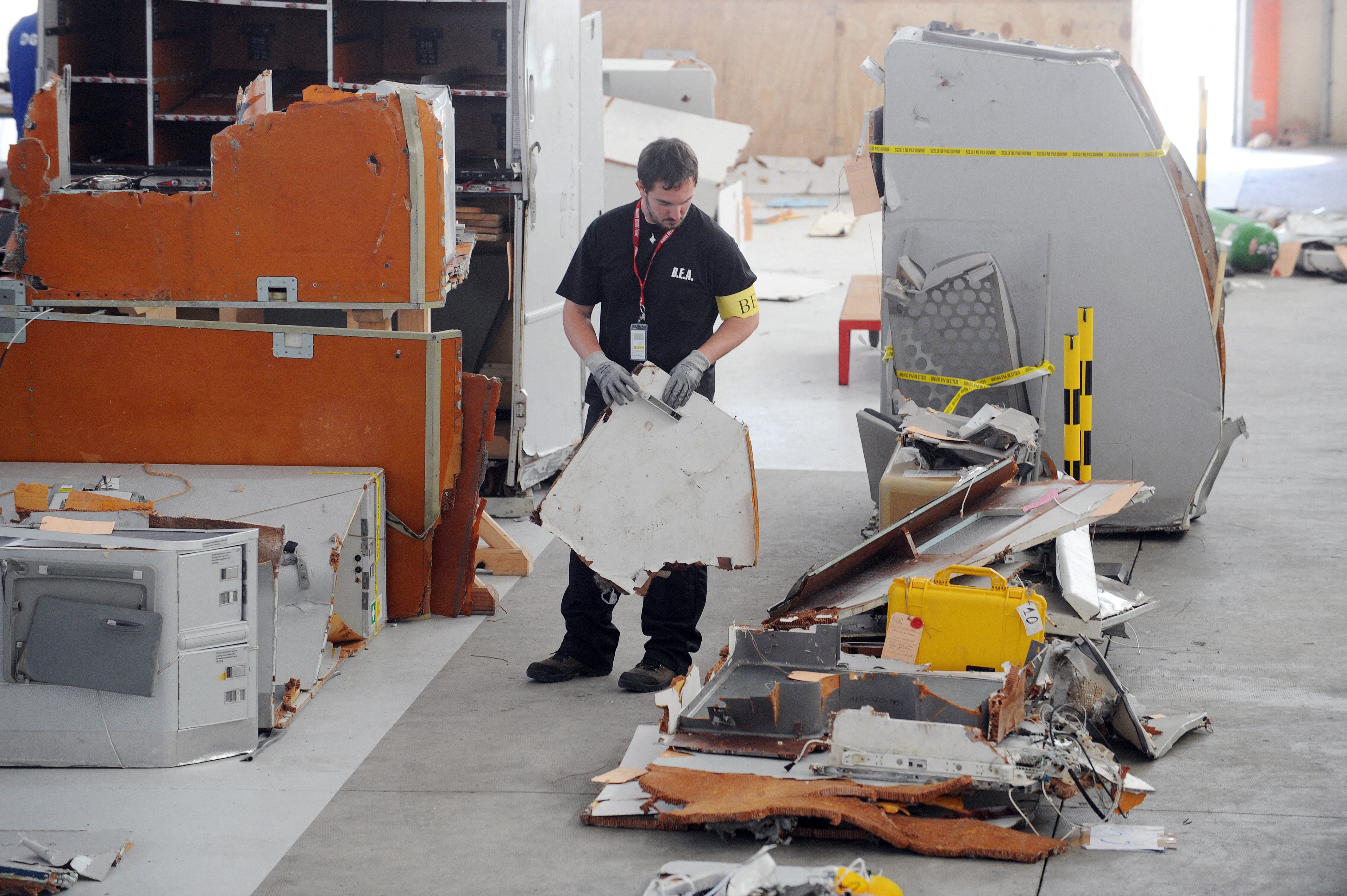 An investigator from the BEA (the French bureau leading the crash investigation) inspects debris from the mid-Atlantic crash of Air France flight 447, in July 2009
