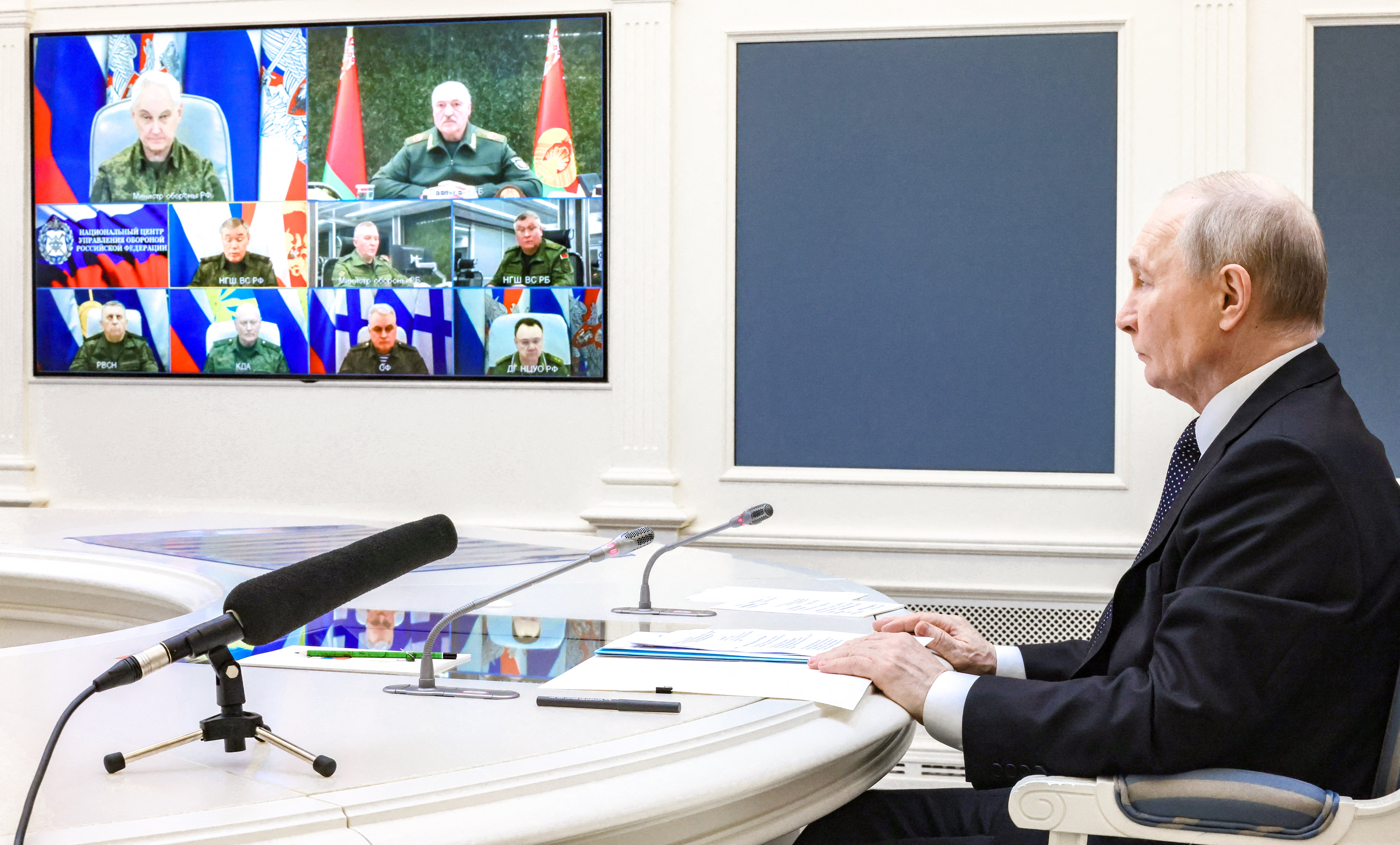 In this pool photograph distributed by the Russian state agency Sputnik, Russia's President Vladimir Putin oversees the joint Russian-Belarusian nuclear weapons drills along with Belarusian President, via a videolink in Moscow (AFP/Getty)