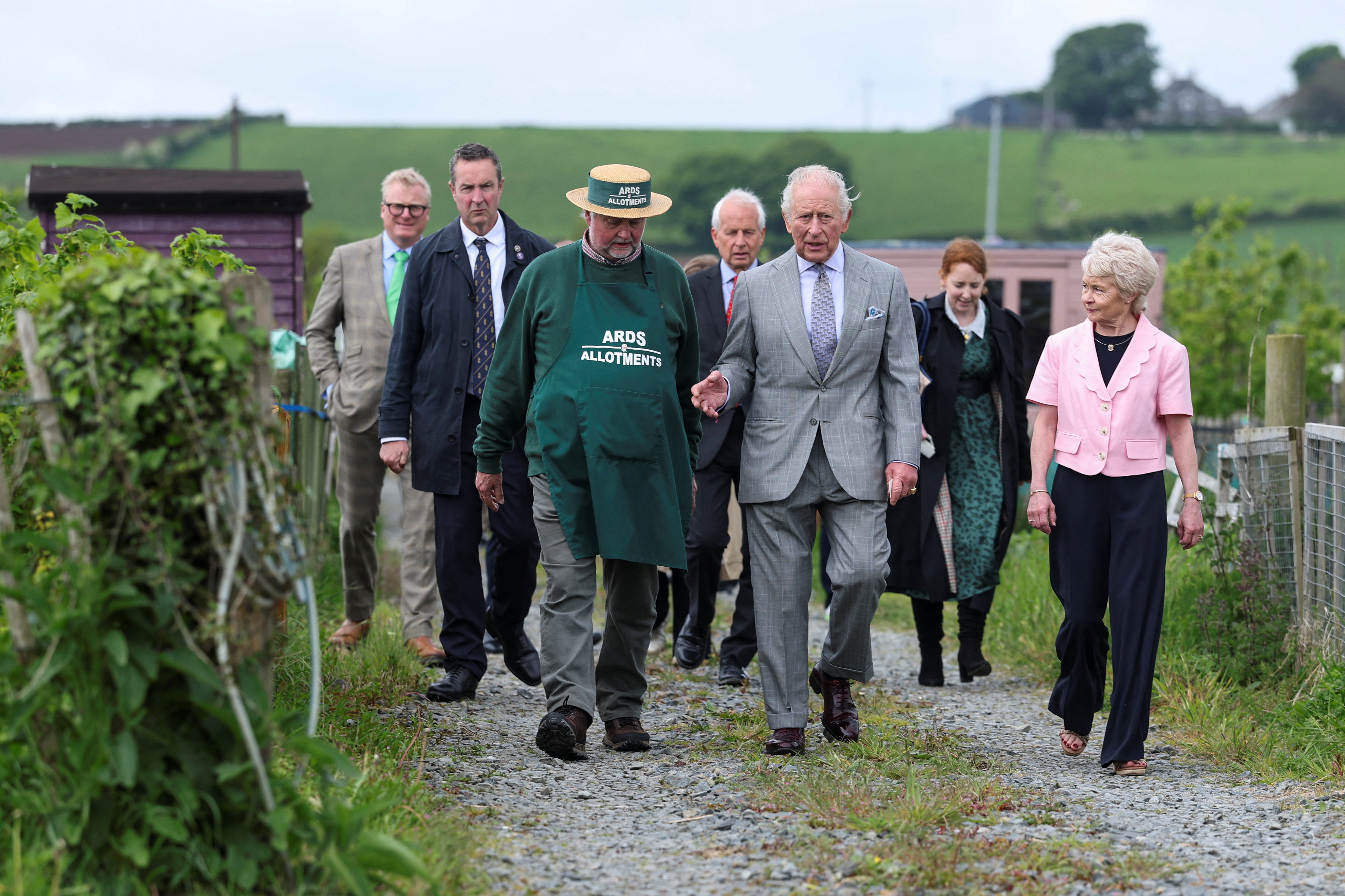 King Charles engaged with the diverse group of volunteers, gardeners, and growers, observing how the plots foster both the cultivation of produce and vital social connections