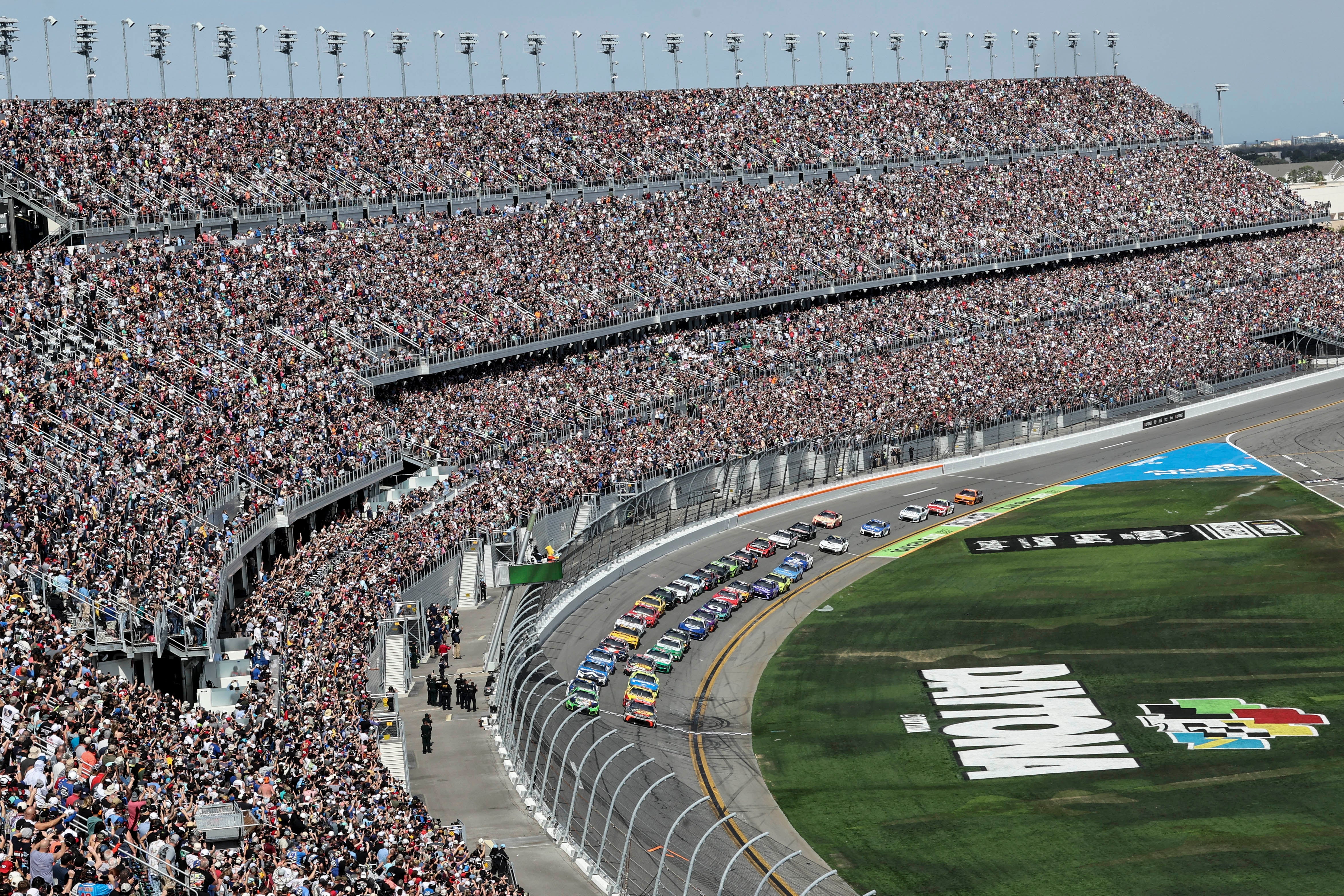 Cars move during the NASCAR Daytona 500 auto race at Daytona International Speedway, Feb. 15, 2026, in Daytona Beach, Fla.