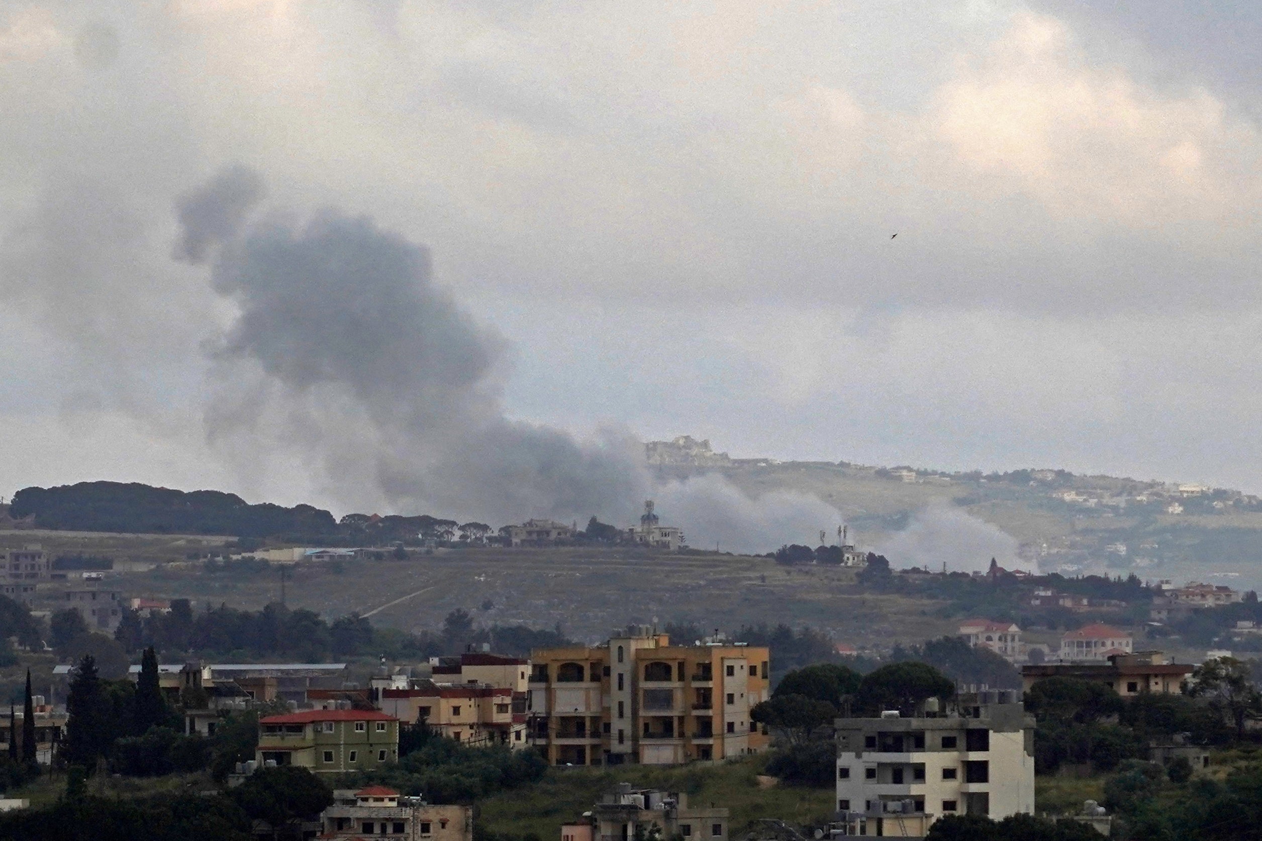 Smoke rises from the site of an Israeli strike in Kfar Tibnit, Lebanon, on Thursday, 21 May