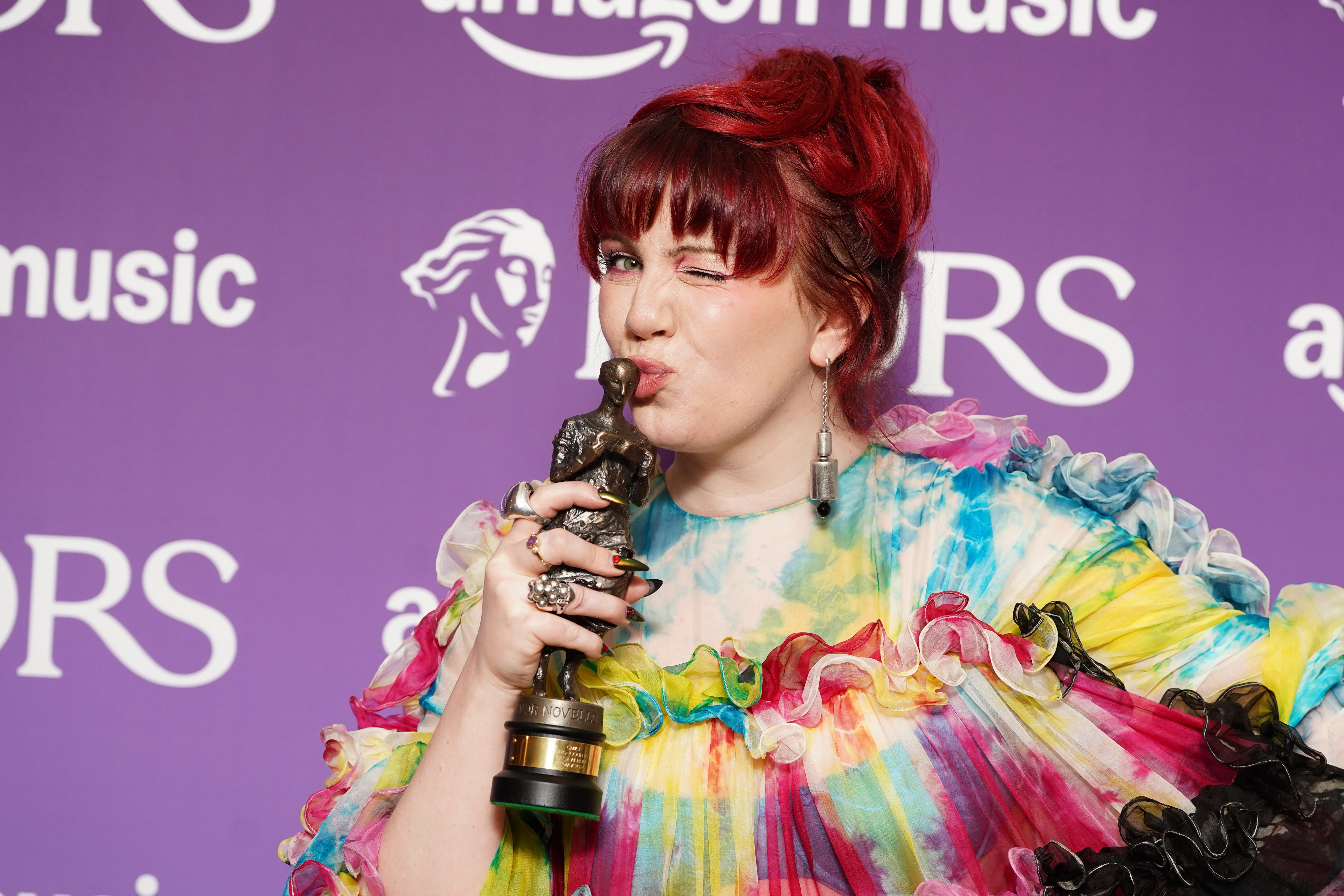 CMAT with her Best Album award for Euro-Country at the Ivor Novello Awards.