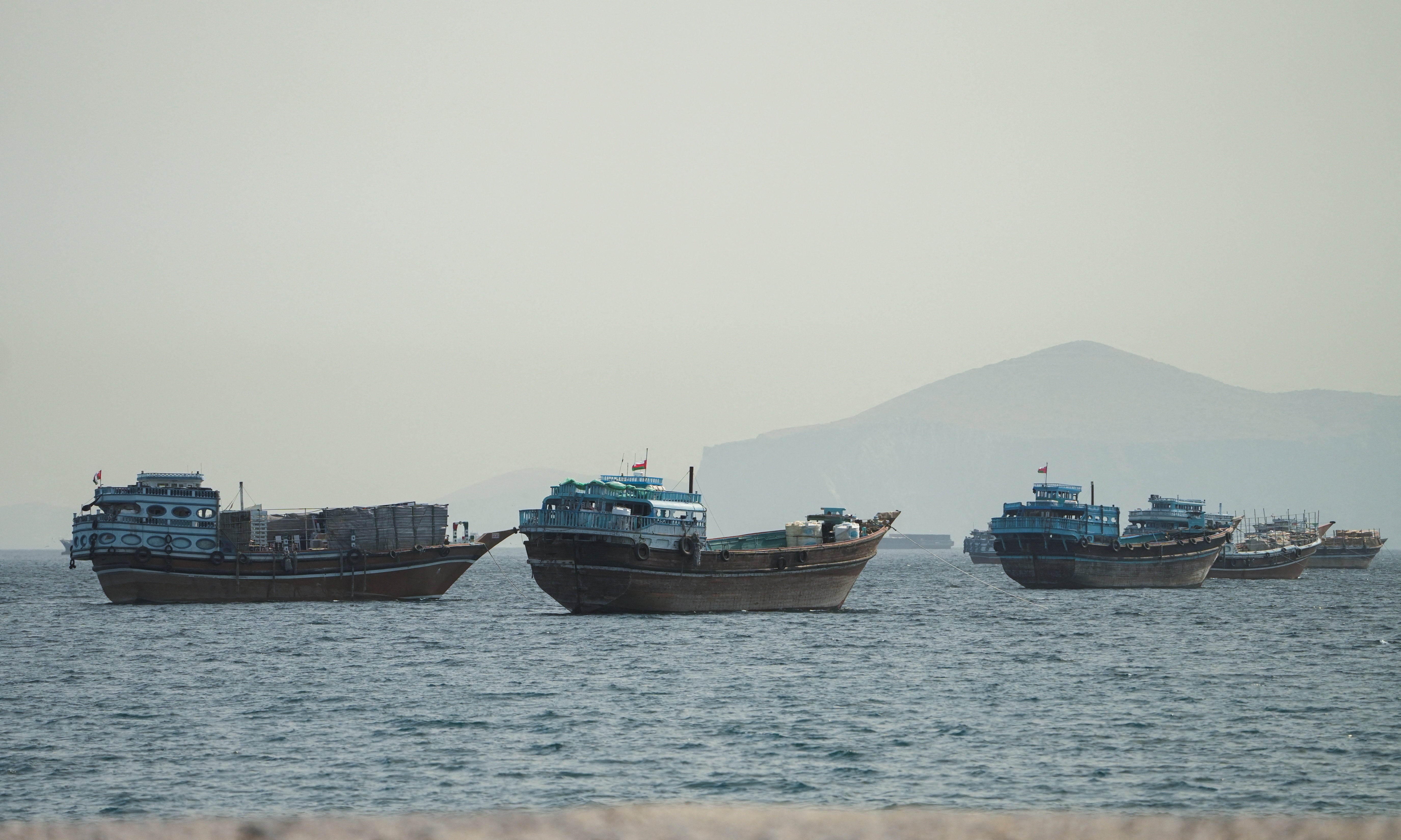 Vessels sail through the Strait of Hormuz, Musandam, Oman, May 22