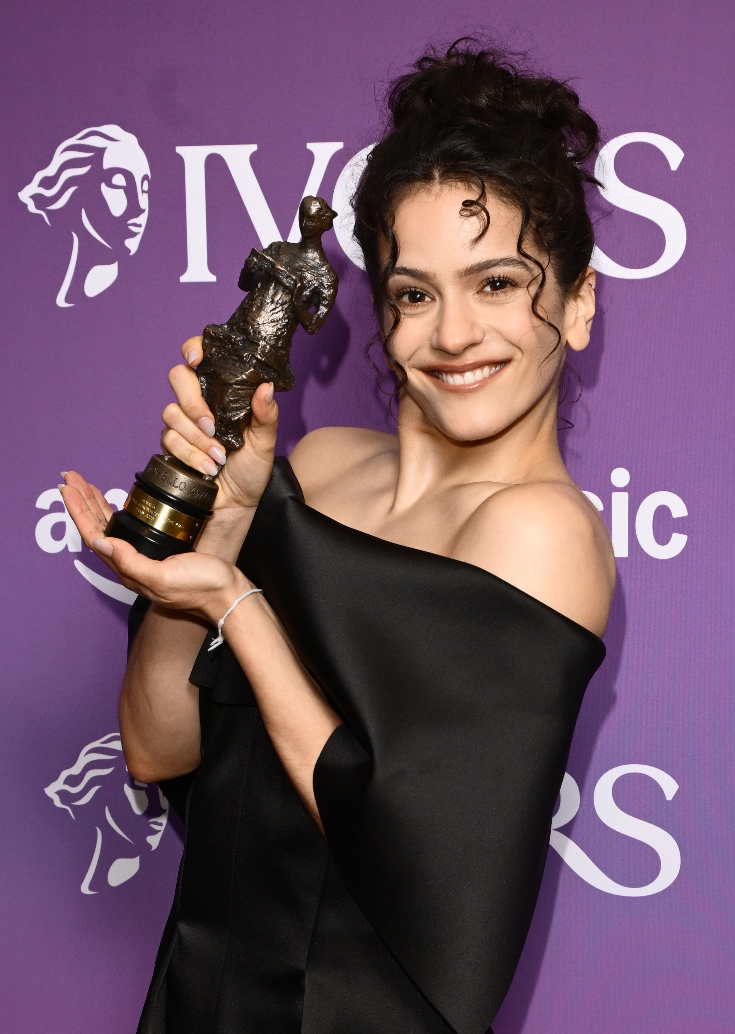 Rosalía with the International Songwriter of the Year award for the album Lux .