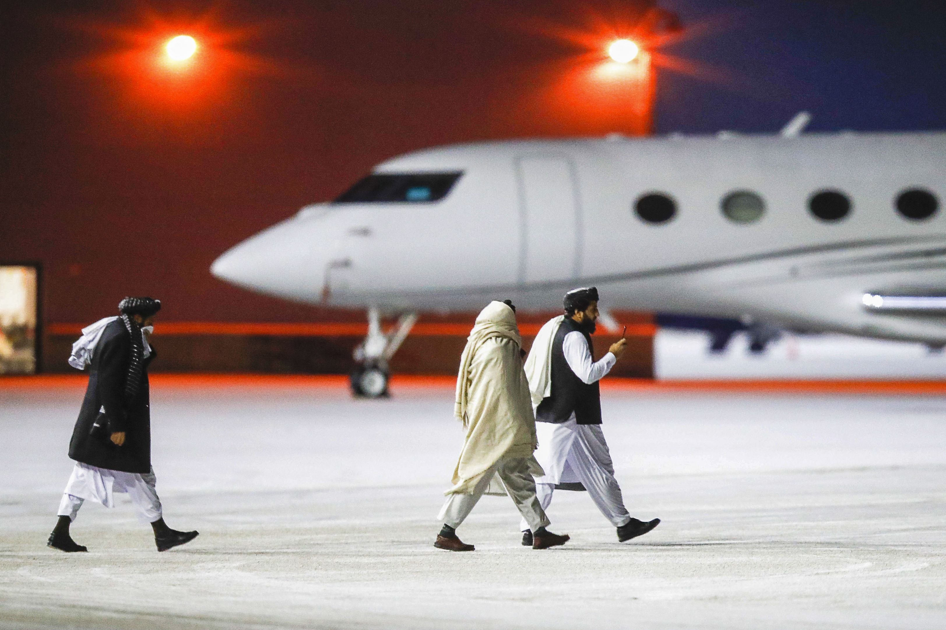 Representatives of the Taliban leave Gardermoen airport after attending meetings with international officials and humanitarian organisations at the Soria Moria hotel in Oslo (AFP/Getty)