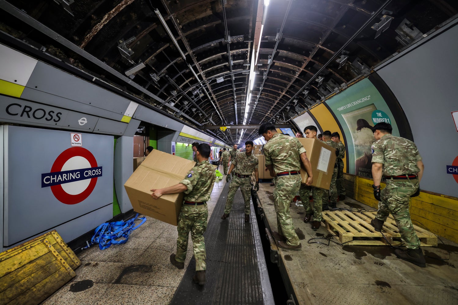 Soldiers unload equipment on to the disused platform as part of its rapid response training exercise