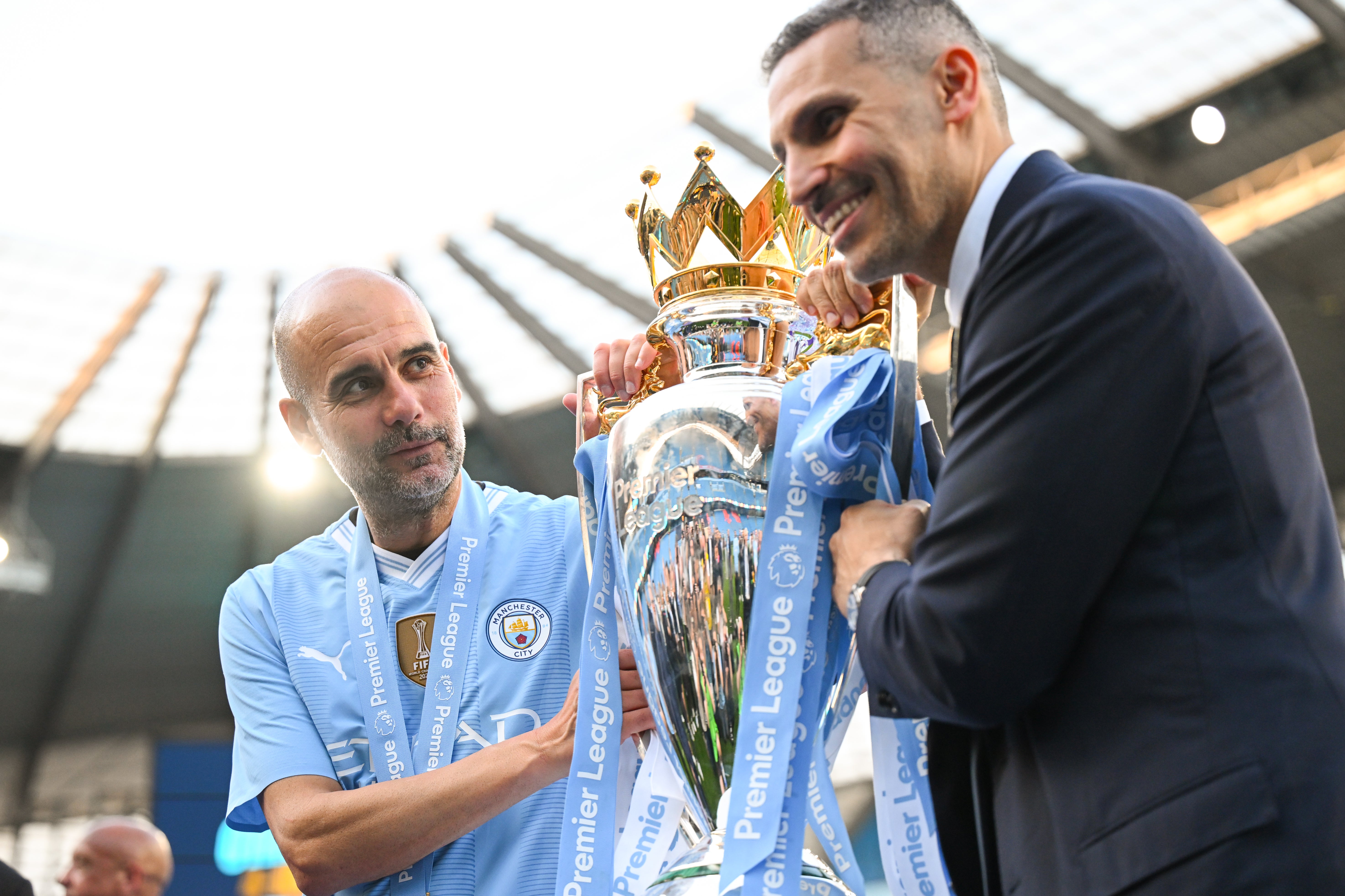 Guardiola with Man City chairman Khaldoon Al-Mubarak and the 2024 Premier League trophy (Getty)