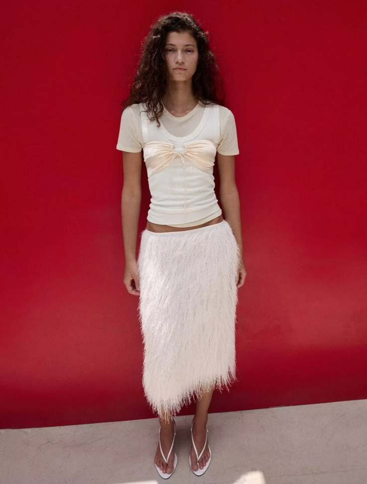 Mango makes this all-white look exciting with fringe details and creative layering